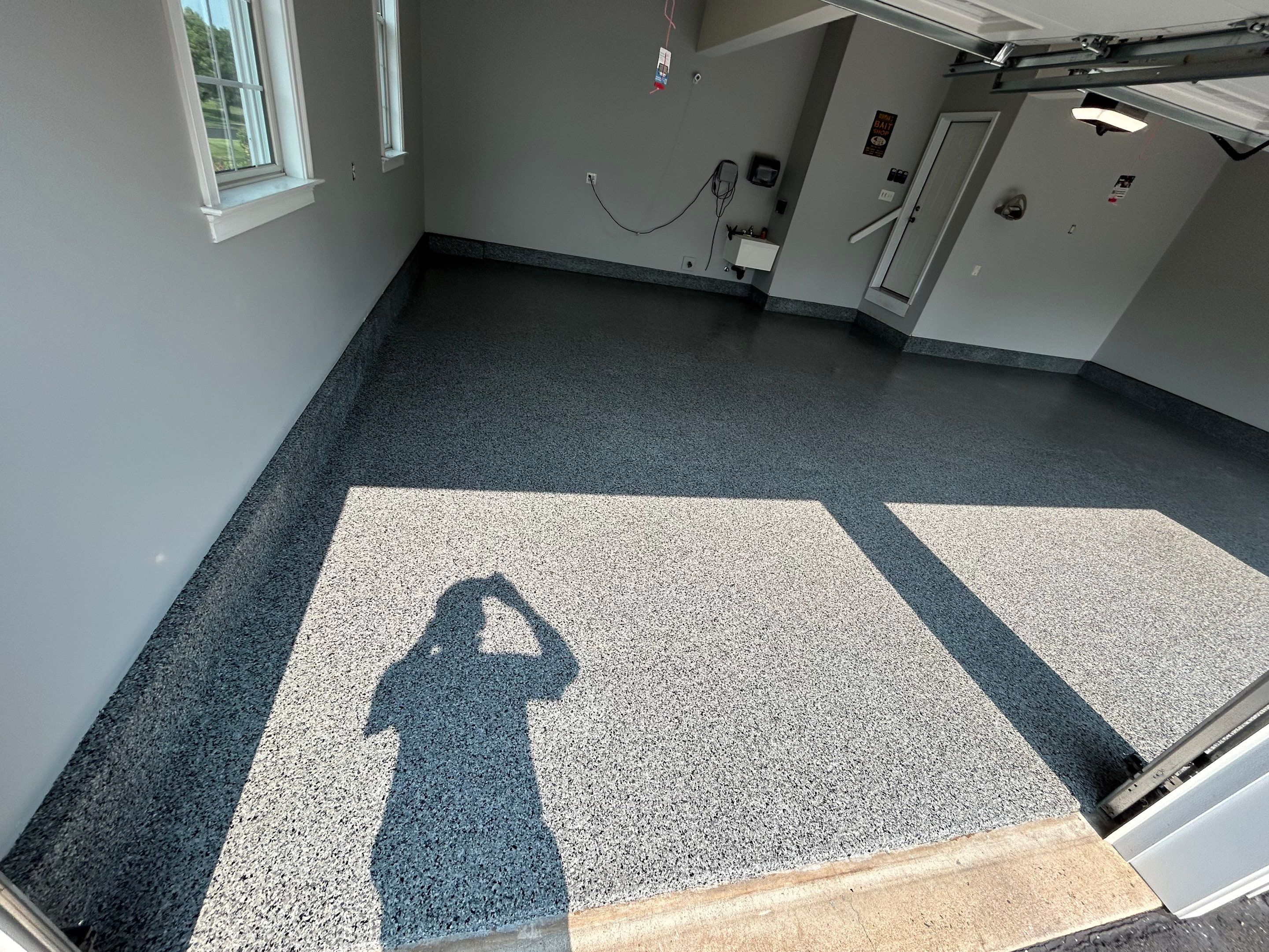 Concrete Floor Coating Transformation by DiGiorgi Roofing and Siding Inc