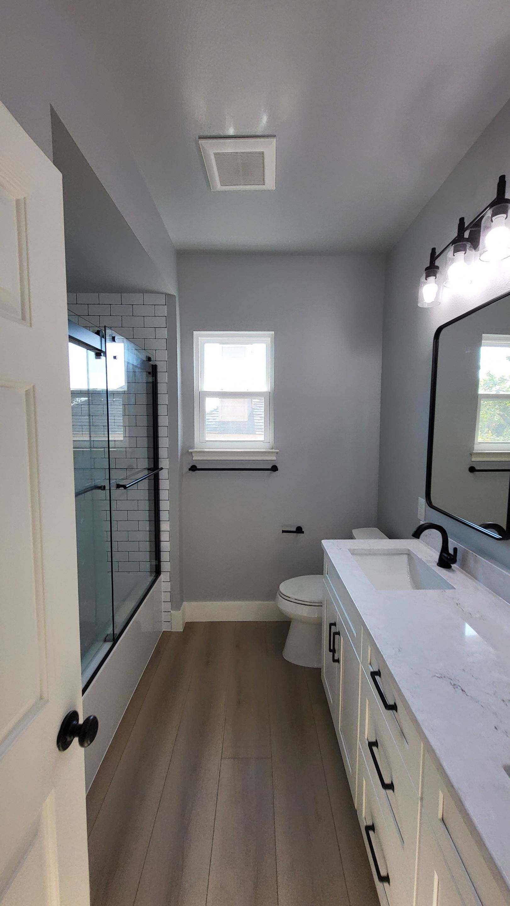 Stone Oak Bathroom Refresh with Modern Subway Tile Before and After by Legacy Bath and Kitchen