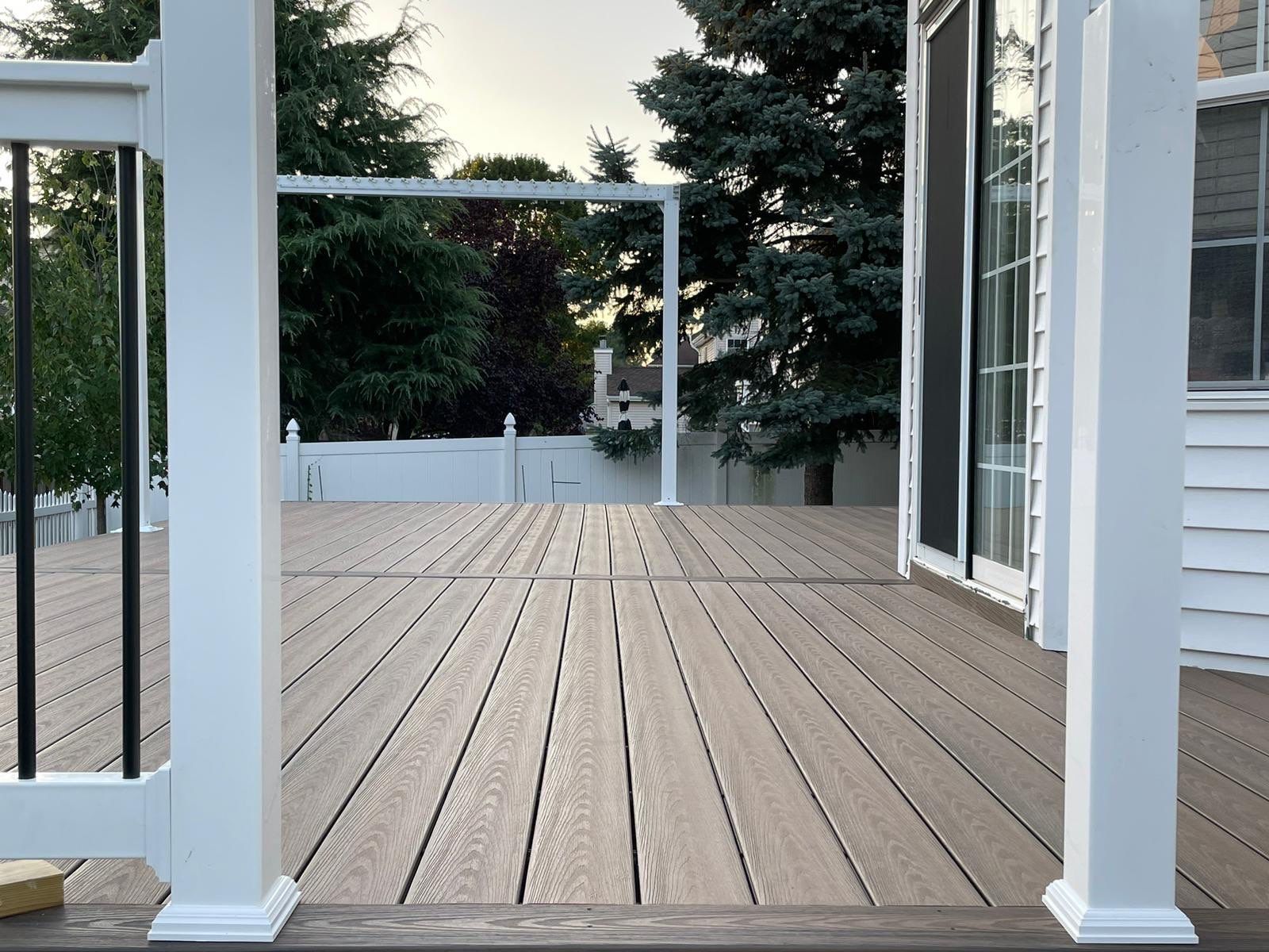 New Deck with Pergola and Vinyl Lattice by deck guardian