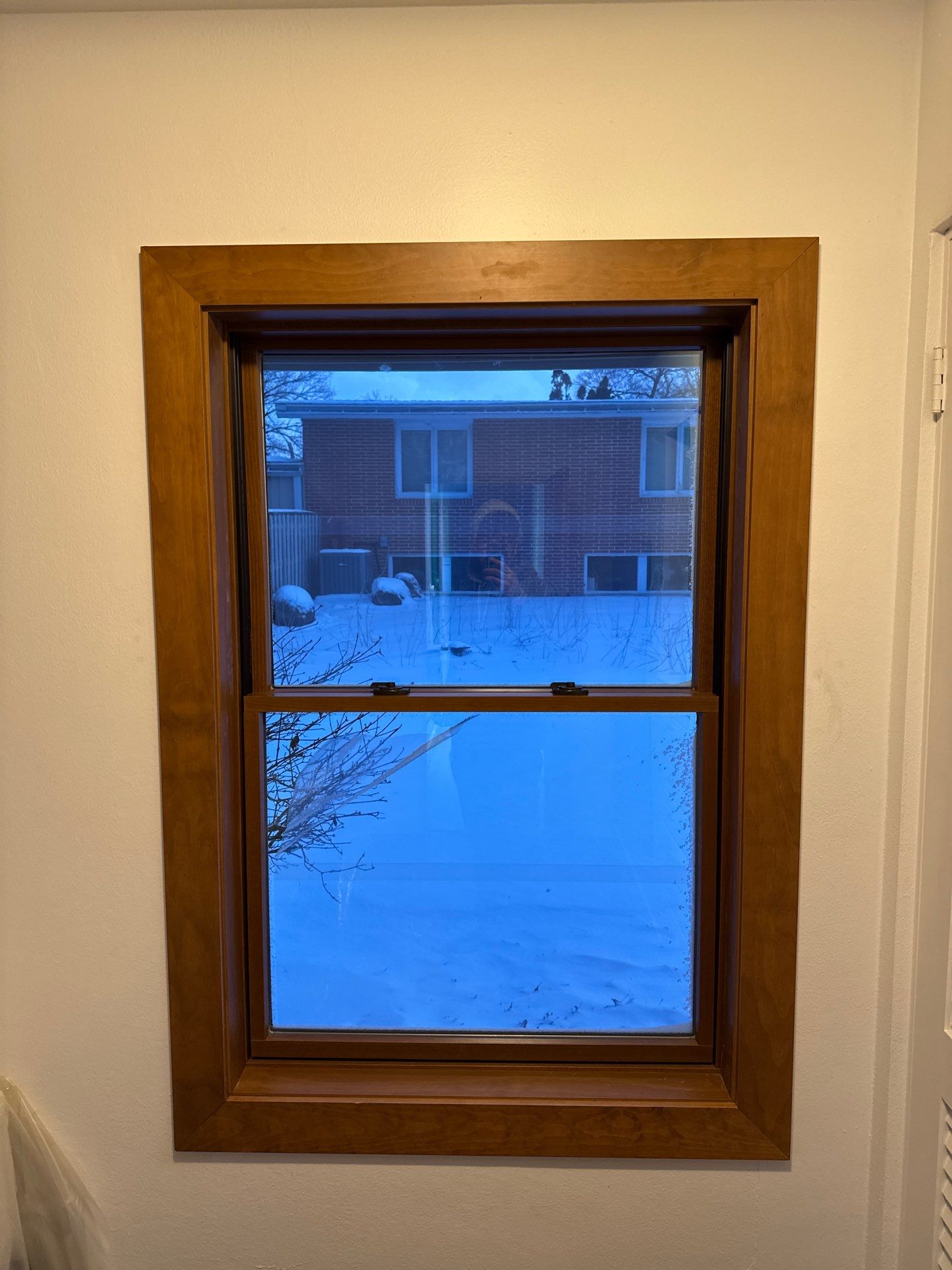 Black-Frame Pella Lifestyle Upgrade on a Partial Brick Home by United Windows and Siding LLC