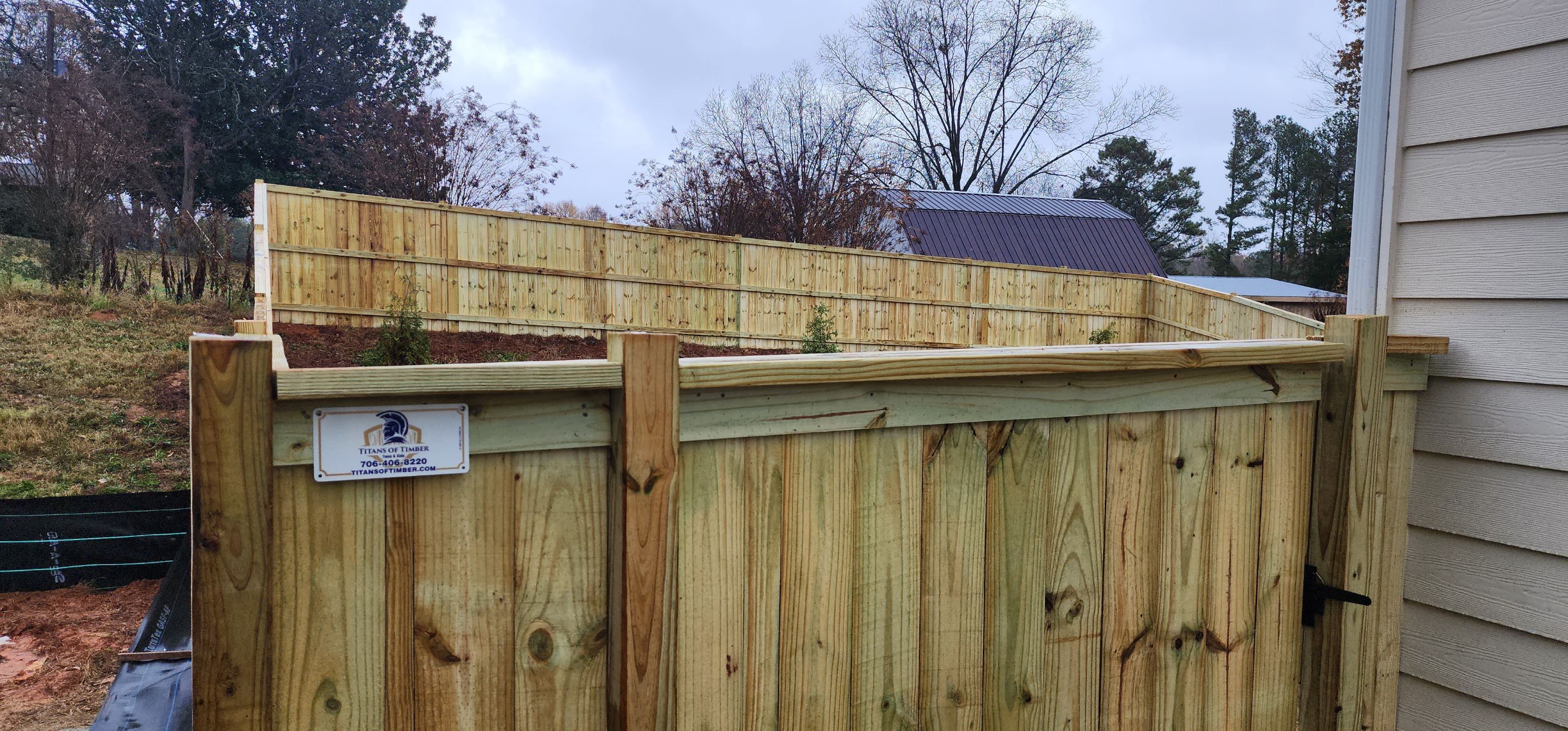 Fence Installation of Capped Wood Privacy by Titans of Timber Fence & Stain