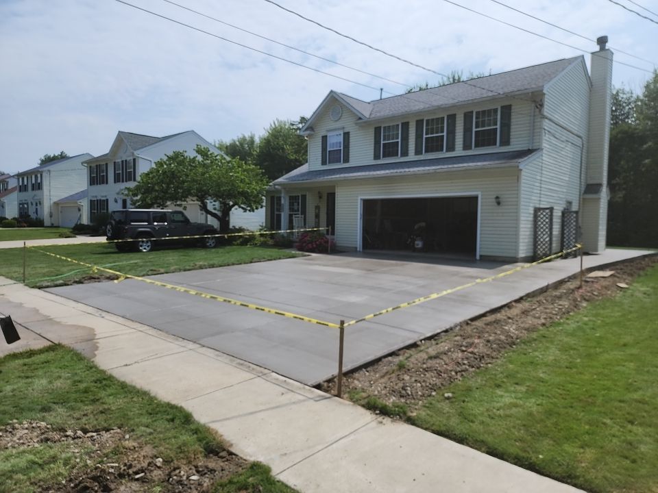 Stamped Concrete, Entry Door, and Concrete  by Ivy Lea Construction