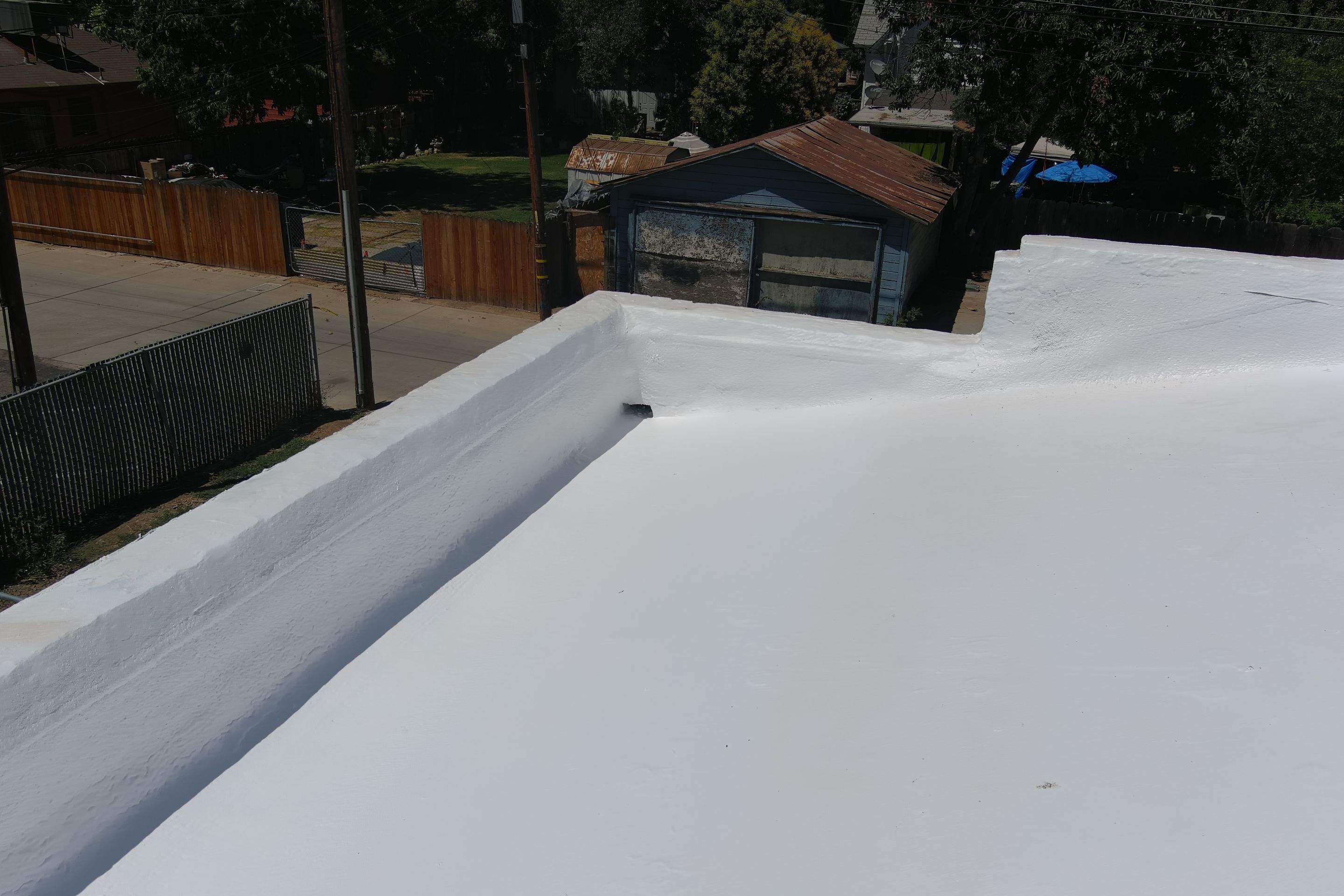 Commercial Roofing Installation using Conklin BenchPly system with PUMA top coat (imbedded fabric system) by Straight Edge Roofing Inc