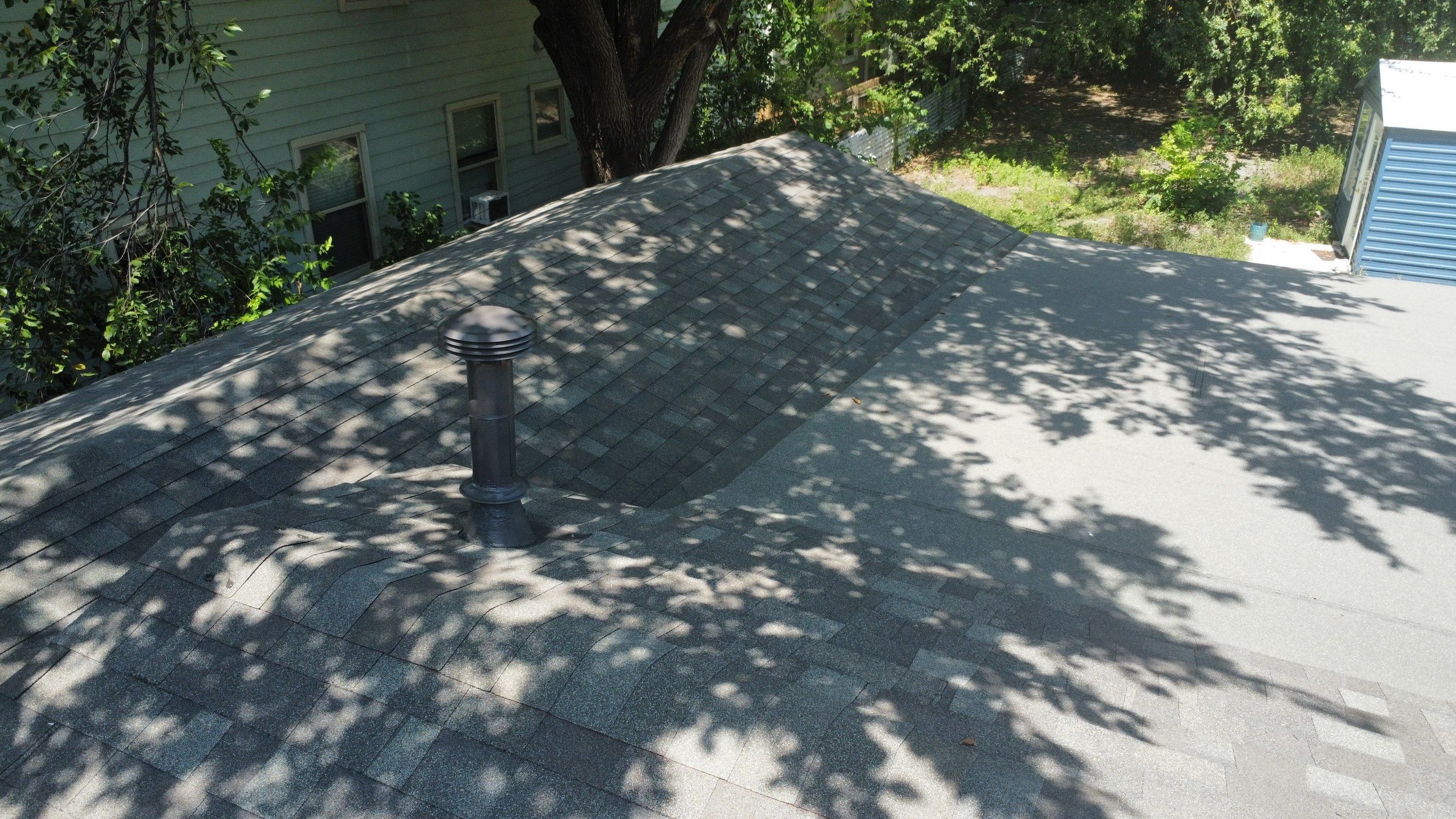 Mixed Roof System ā Oakridge Driftwood + Flat Roof Section | Austin, TX by Kstylez Roofing & Construction