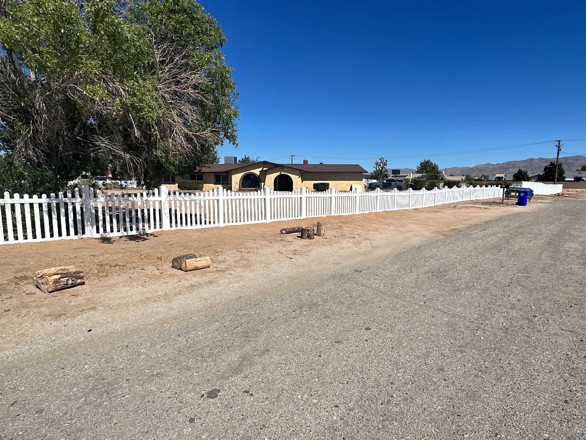 White picket fence  by Fence Guys Inc. 