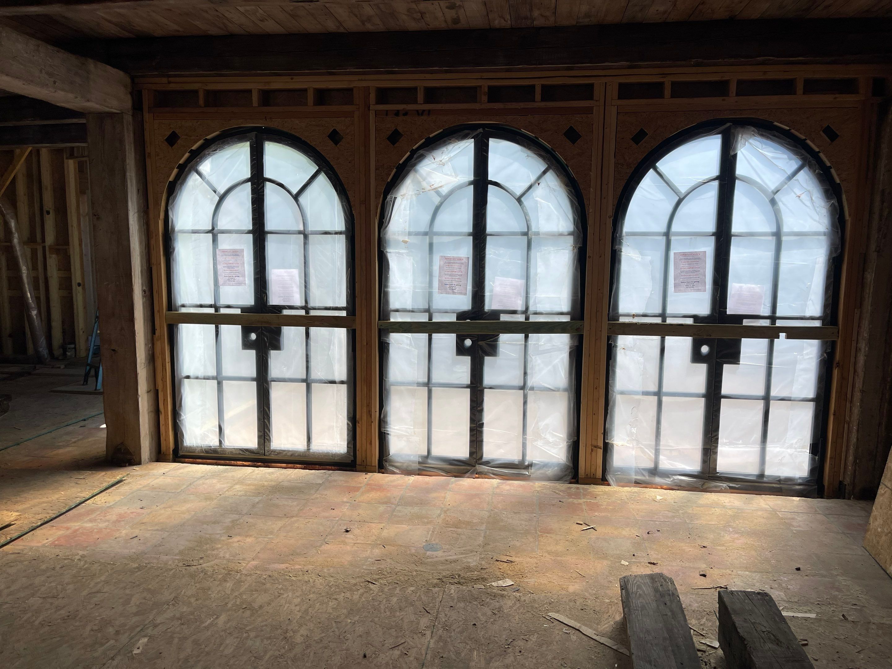 Arched Black Metal French Door Installation and Finishing in Fort Worth by Solara Custom Living