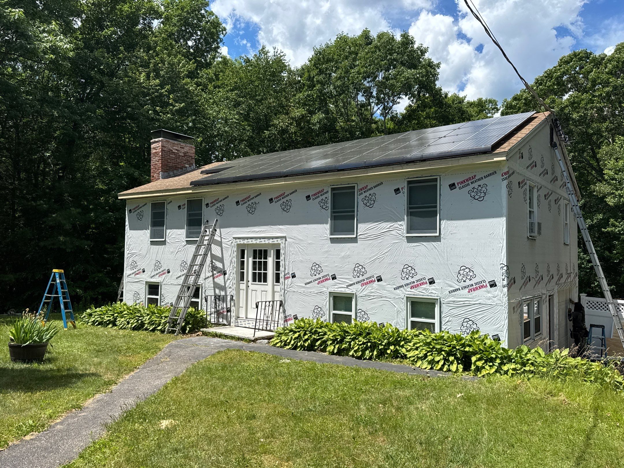 Full Siding Replacement in Newmarket, NH with CertainTeed Vinyl Siding and New Front Door Installation by Compass exteriors