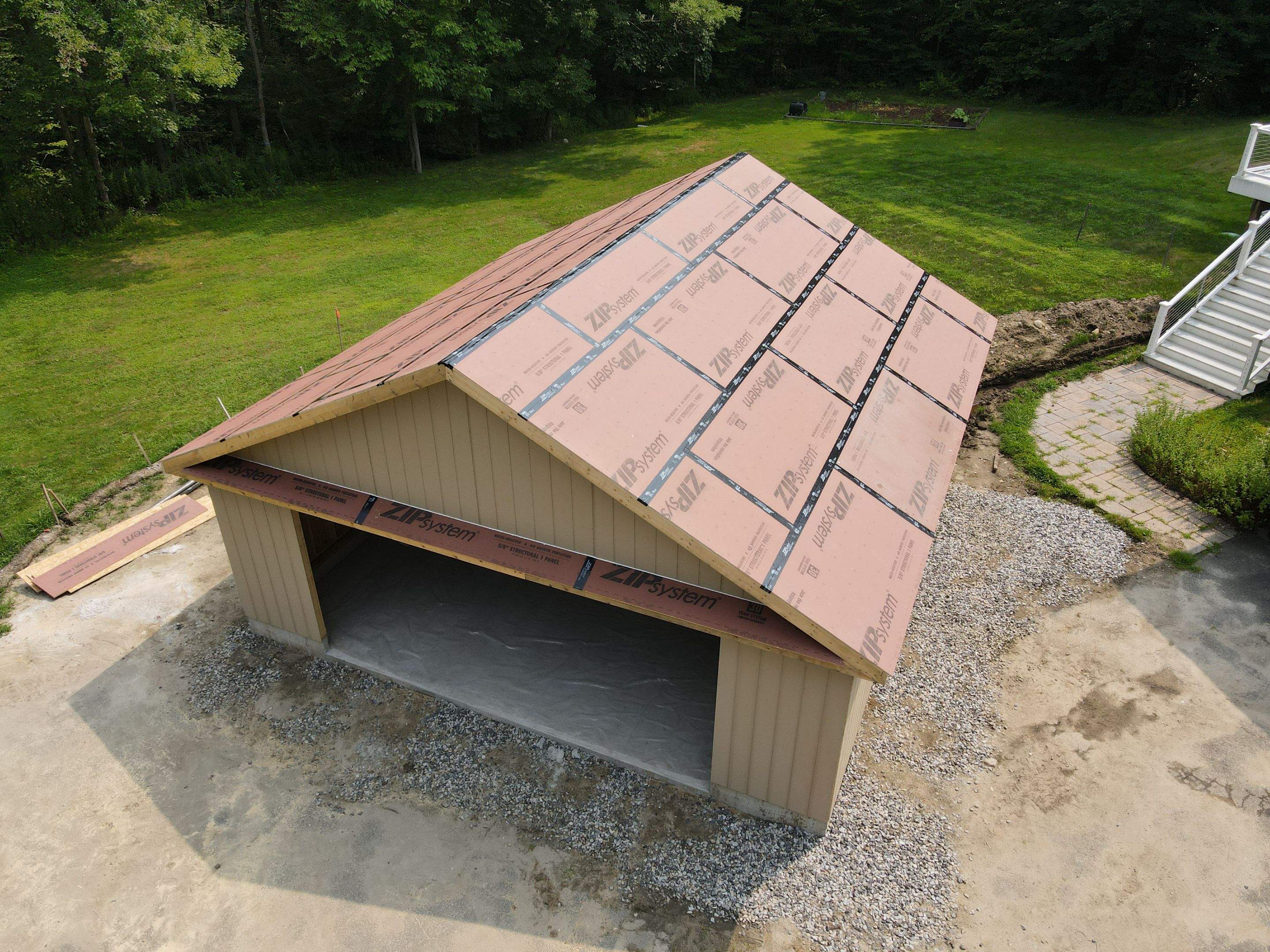 Two-Car Garage using LP SmartSide Panel Siding by Chagnon Building & Remodeling LLC
