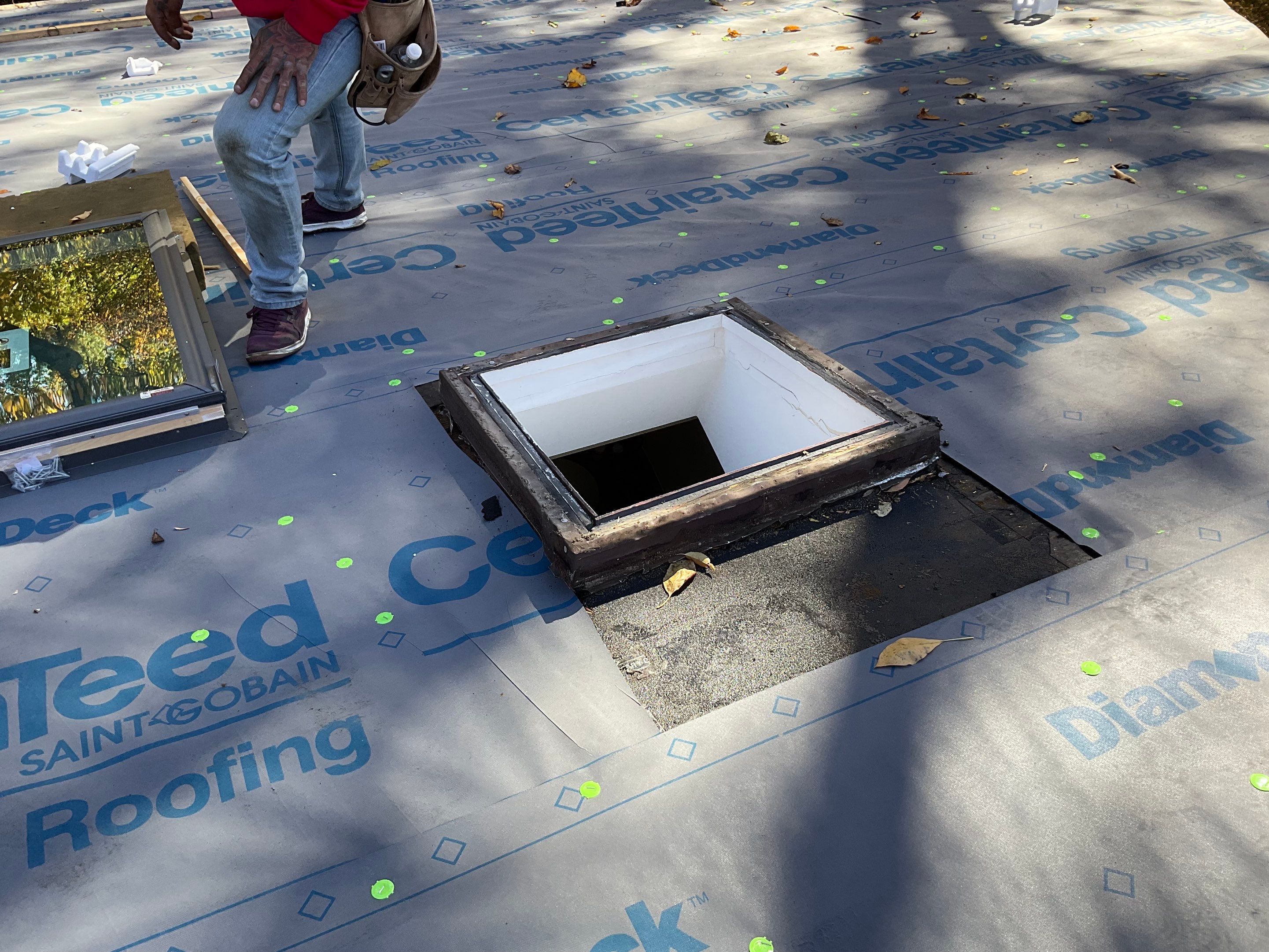 Install new shingles and new skylights  by Alpha Design Services