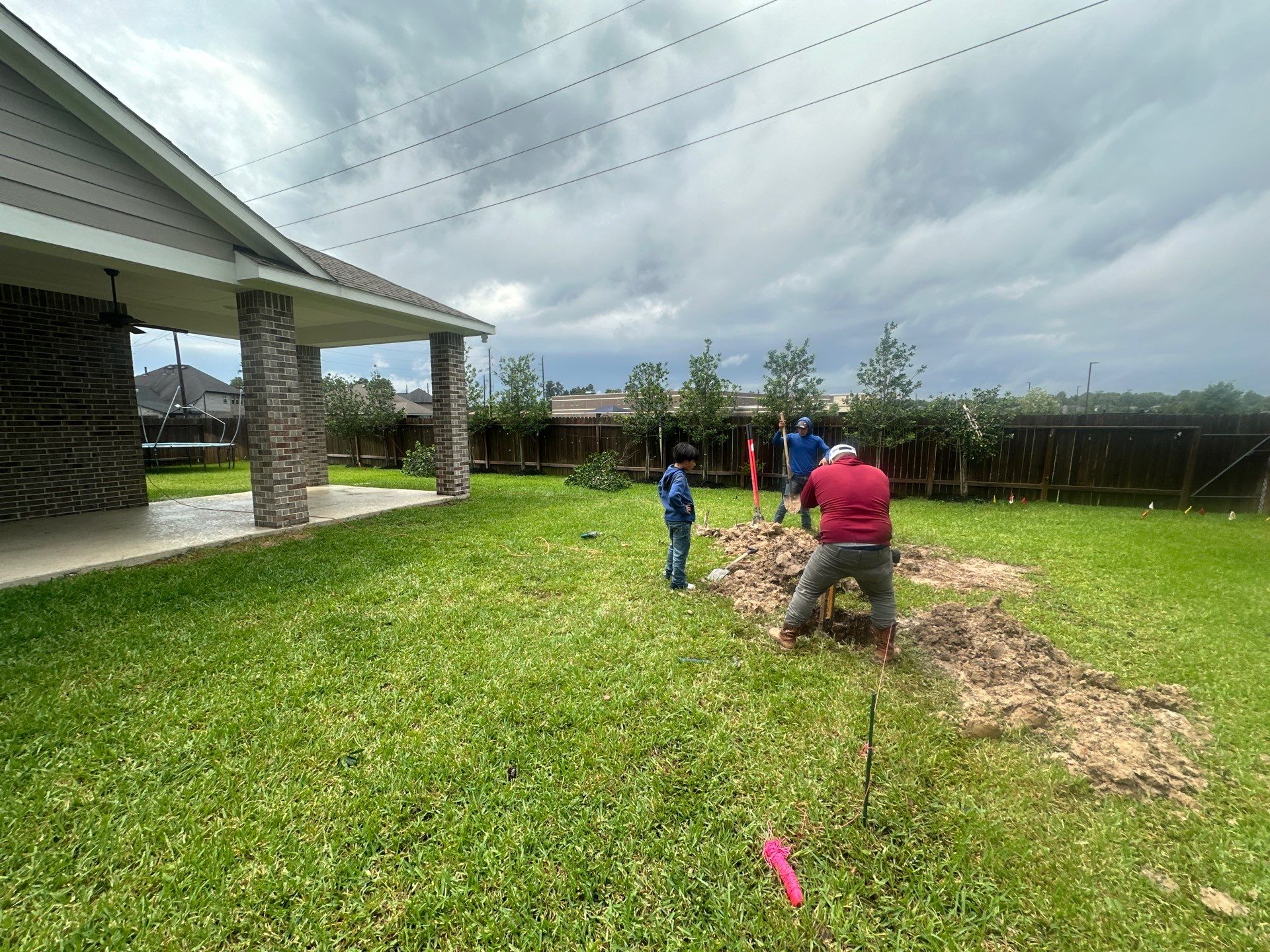 Covered patio and Summer Kitchen in Spring, TX by SophAlx LLC