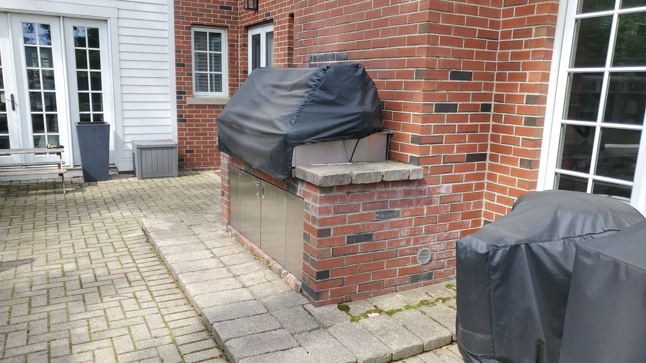 Brick patio repair, clean sand and seal by Northern Power Washing LLC.