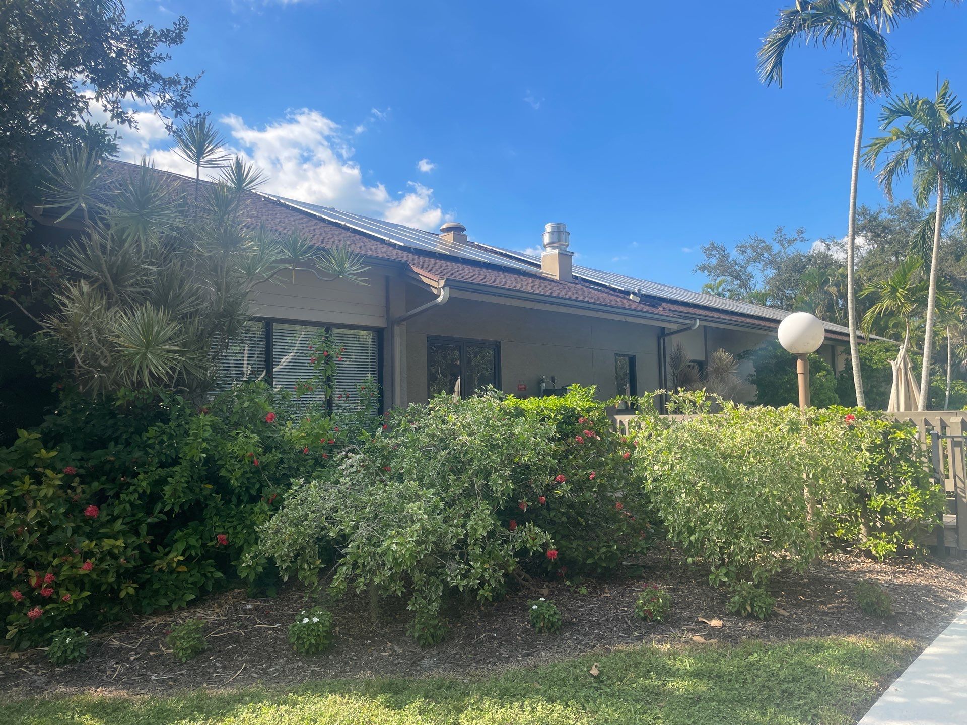 Clean Gutters and Roof in Sarasota FL by Gutter Professors