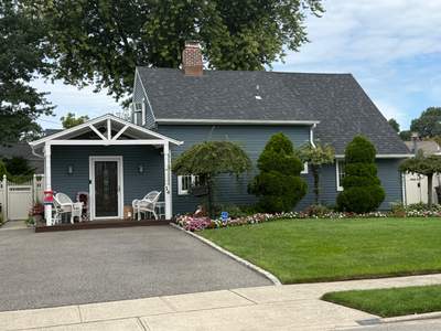 Roof Replacement and Blue Siding Installation in Westbury