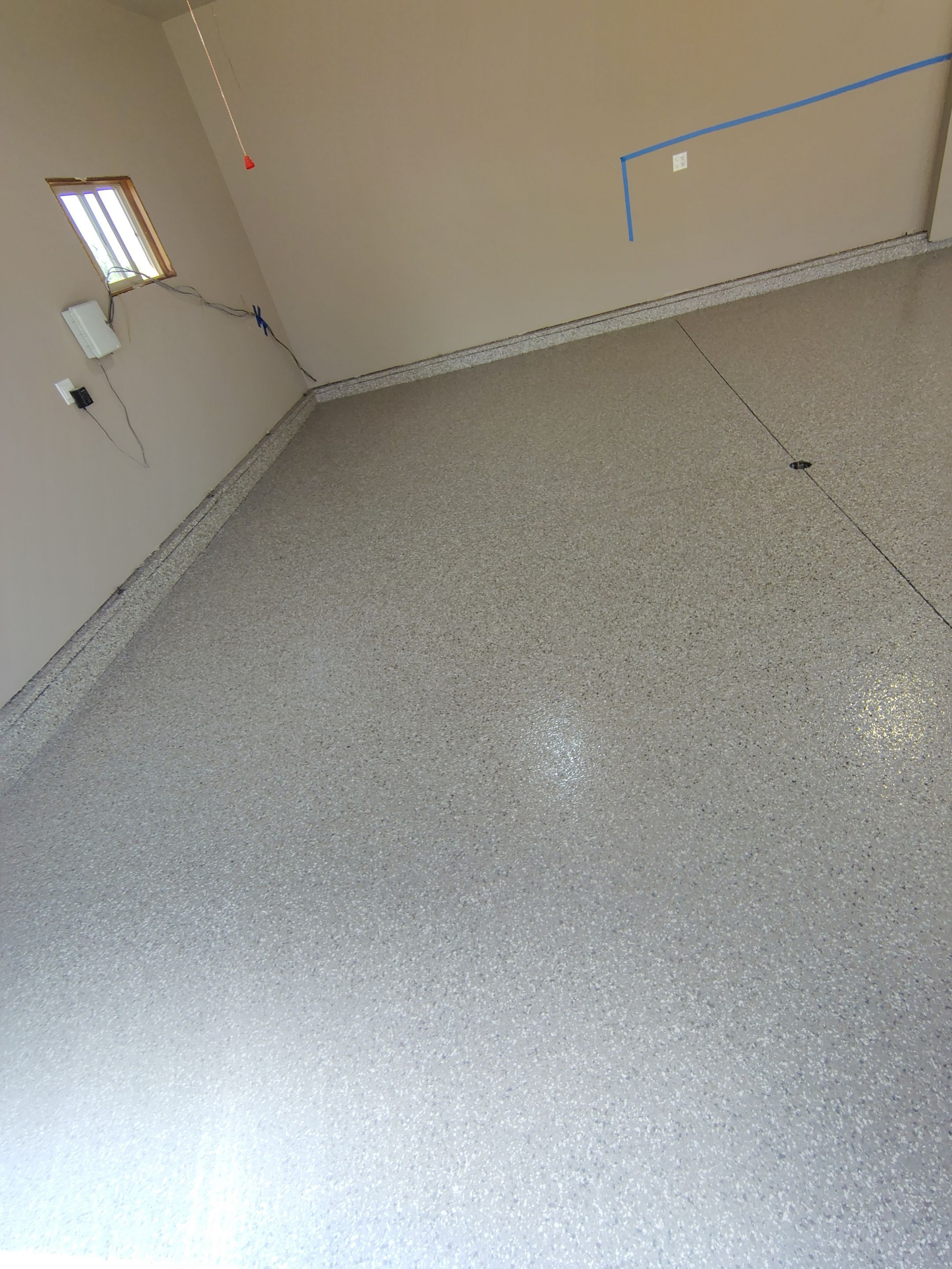 Sioux Falls Garage Concrete Repair and Epoxy Flake Floor Coating by Select Painting, Coatings & Garage Cabinets