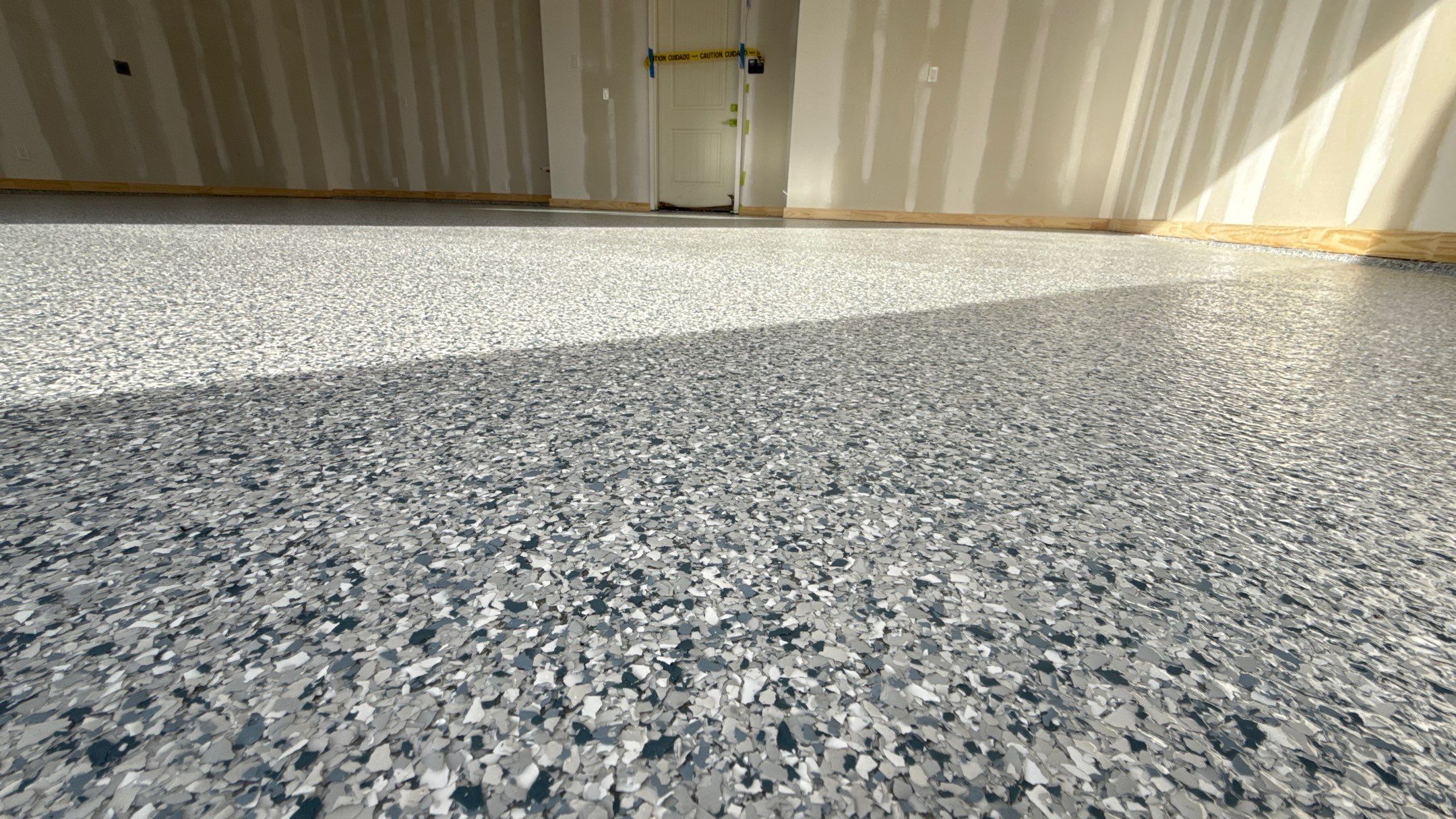 New floor for Dusty Rhodes homes in Raymore! by Banner Garage