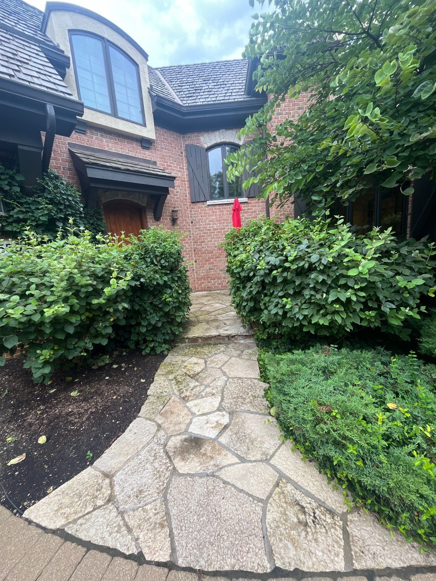 natural stone using Algaecide, soft wash soap by Northern Power Washing LLC.