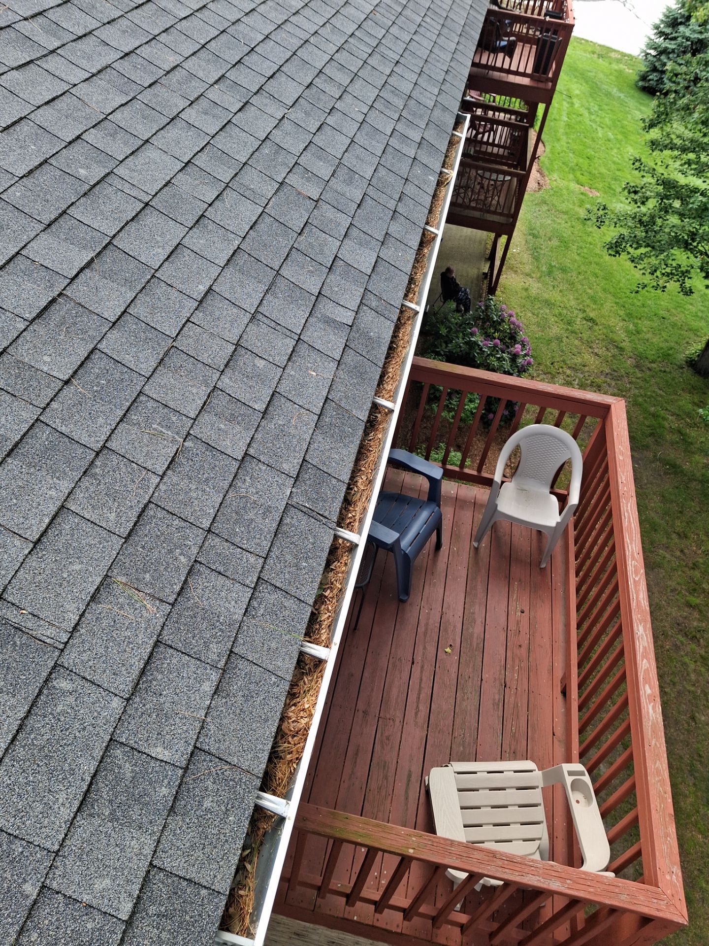 Commercial gutter cleaning New Hampshire before photo with filled gutters