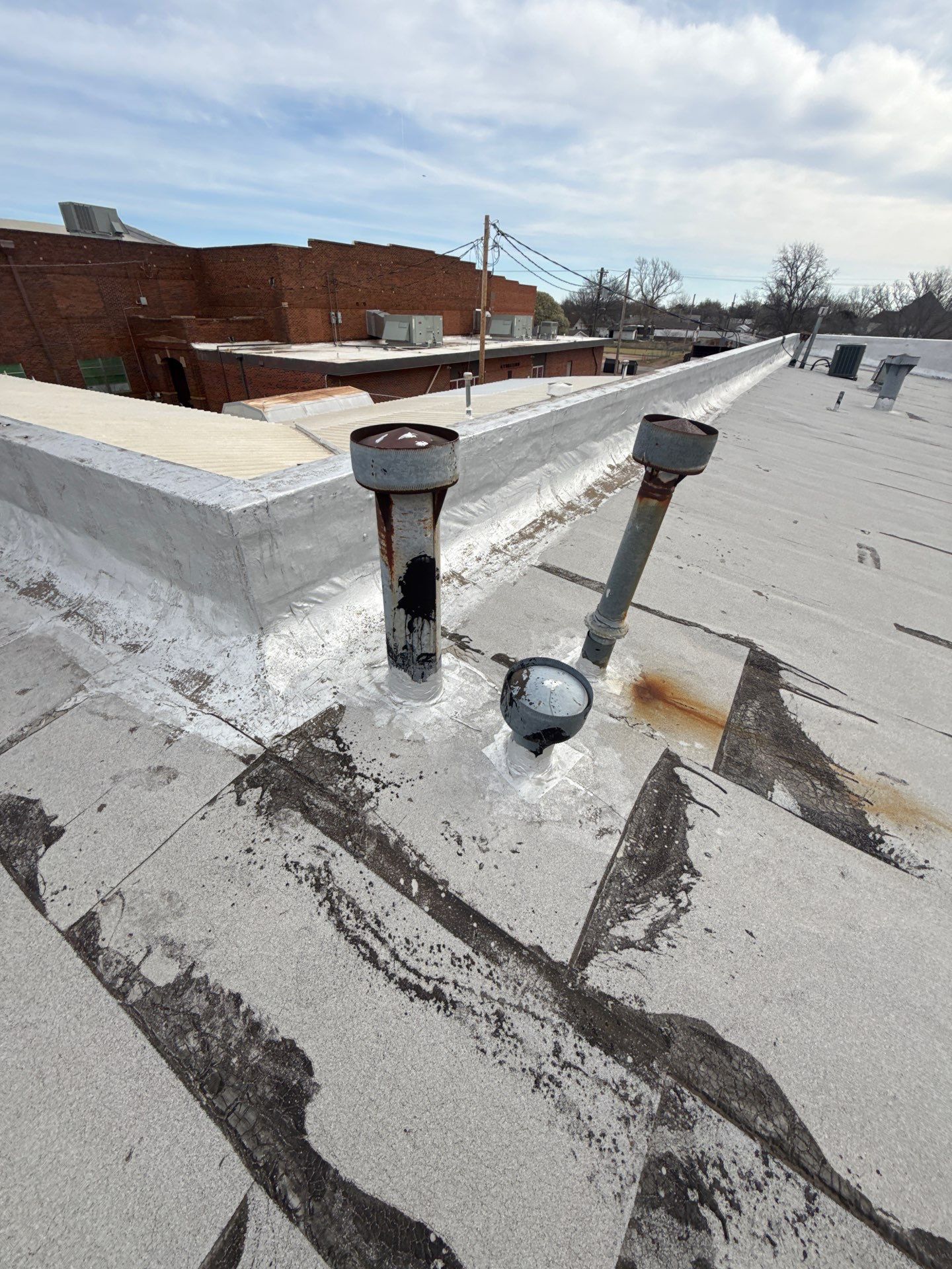 Hollis High School Comprehensive TPO Roof Replacement and Restoration by Secondary Rhodes