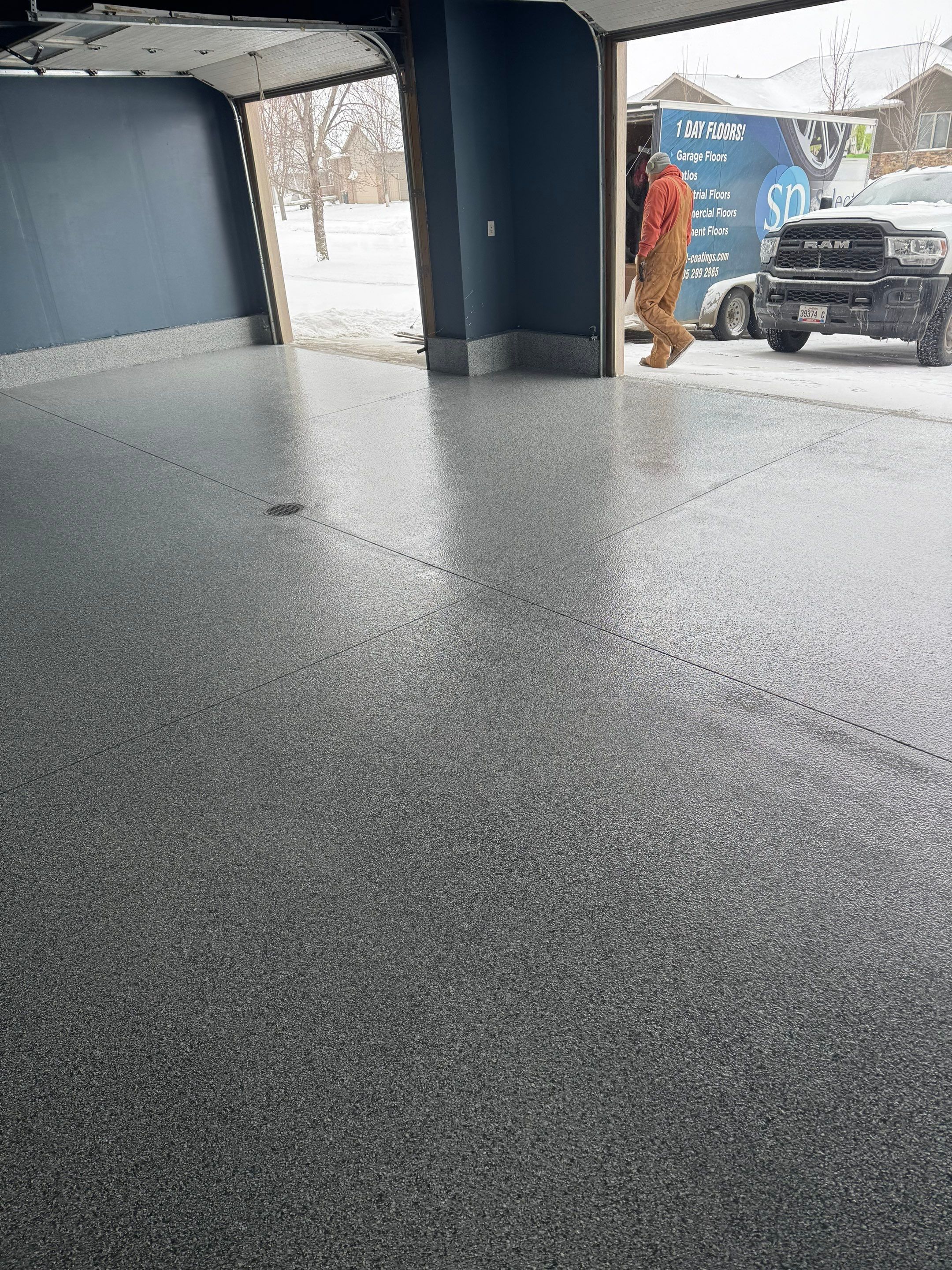 Grey Speckled Epoxy Garage Floor and Stair Coating in Sioux Falls by Select Painting, Coatings & Garage Cabinets