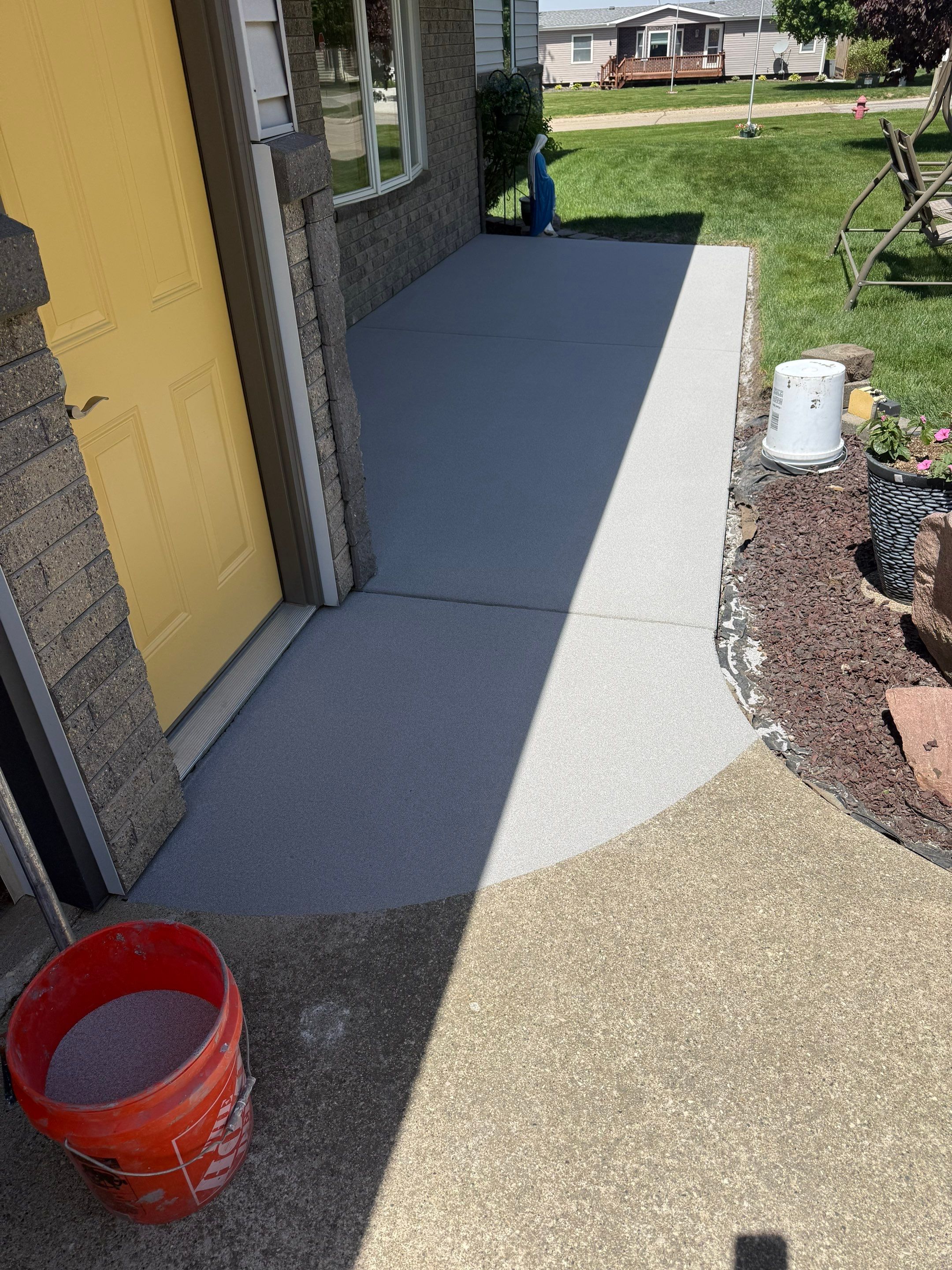 Custom Grey Flake Epoxy Garage Floor Installation in Remsen by Select Painting, Coatings & Garage Cabinets