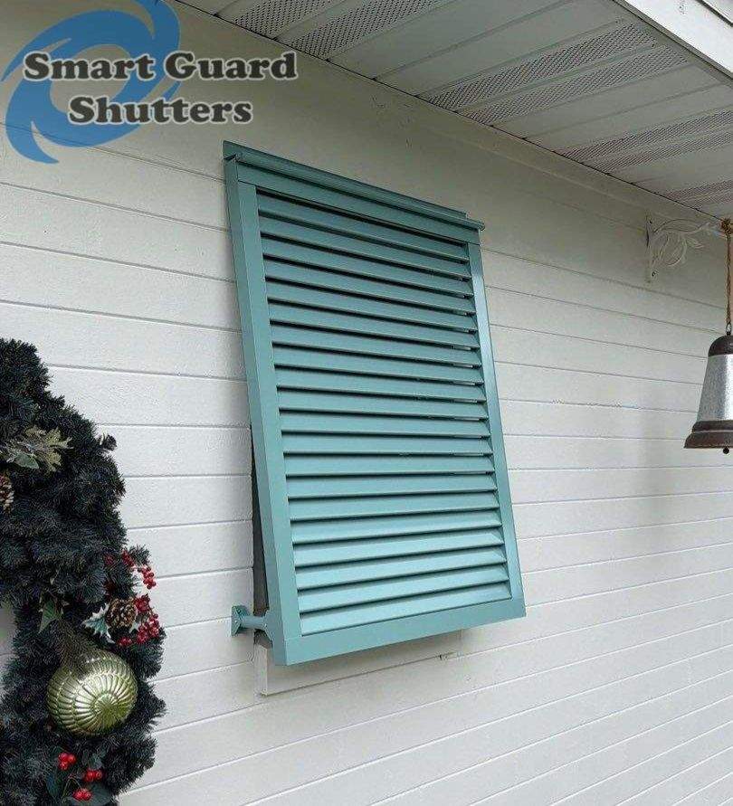 Hurricane Fabric in White / Decorative Bahama in Pastel Turquoise by Smart Guard Shutters