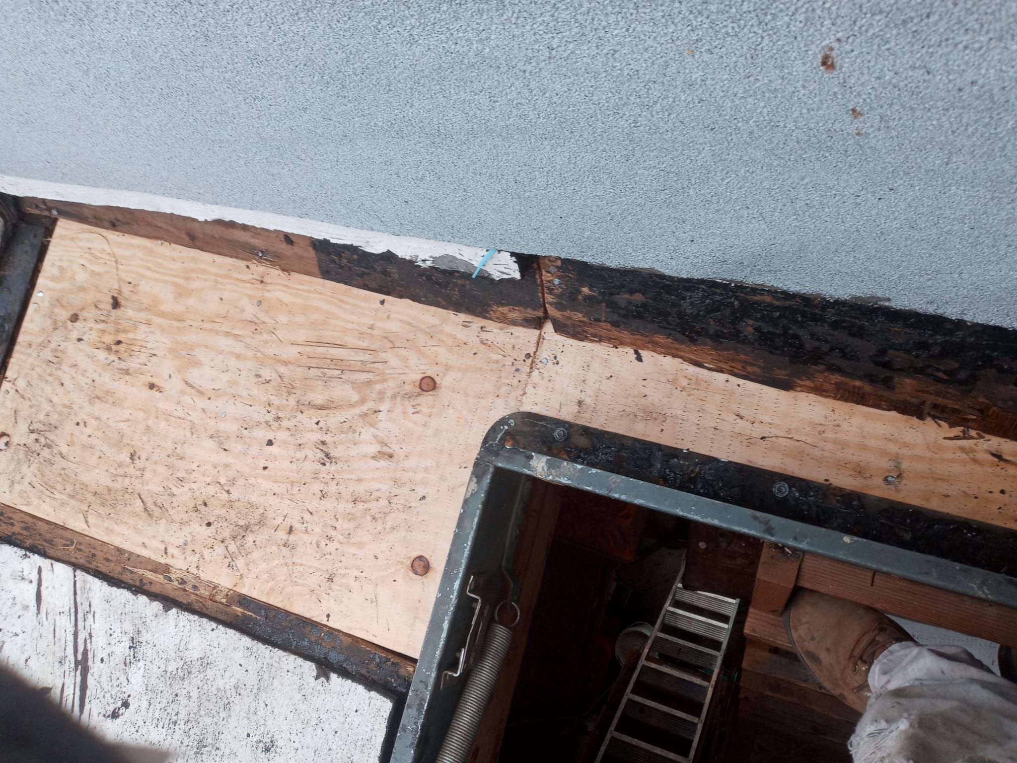 Spray foam and coatings inside commercial building HVAC well using Spray foam and coatings over existing BUR system by Straight Edge Roofing Inc