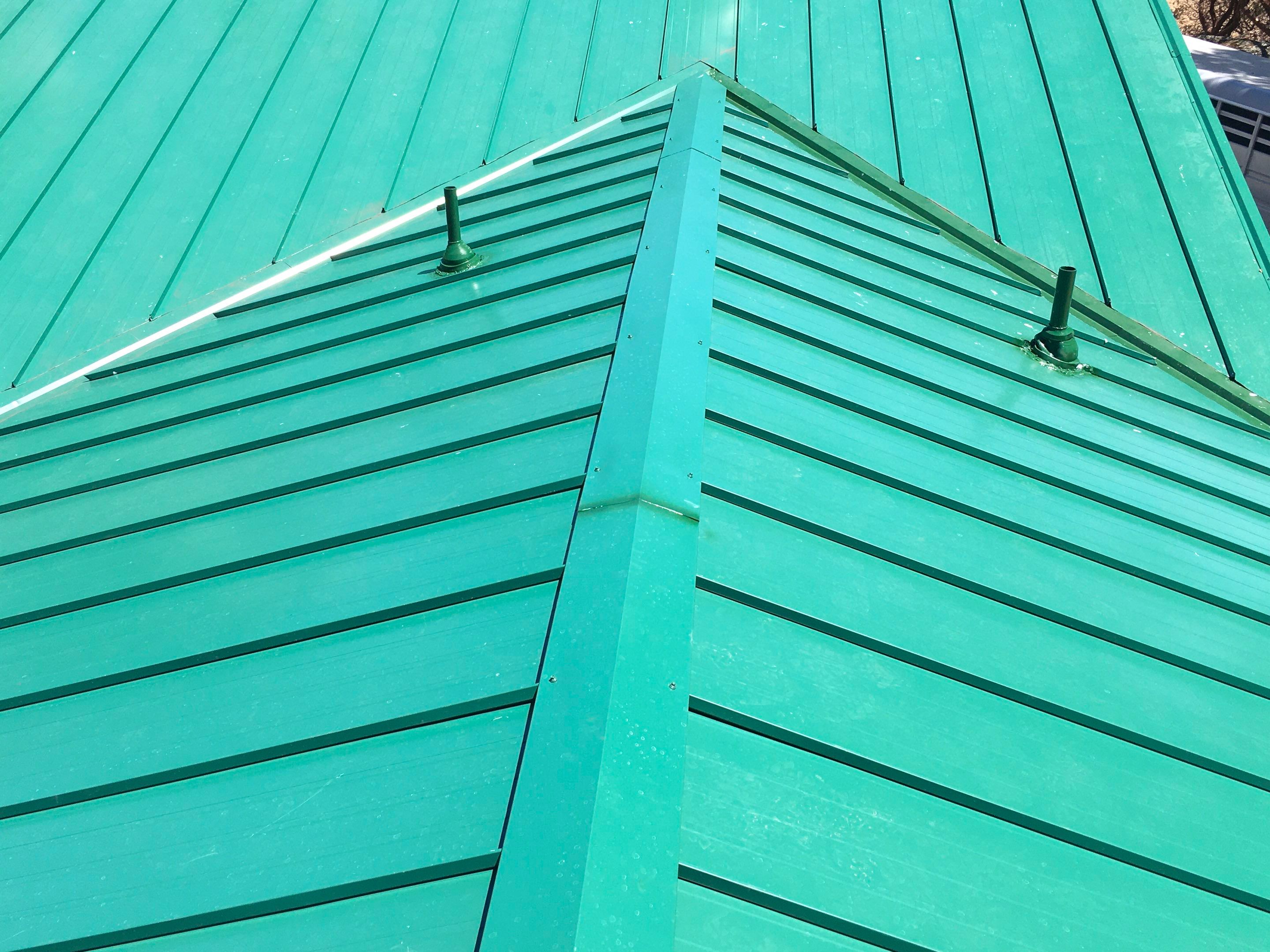 Metal roofing installation using Standing seam metal roofing system by Straight Edge Roofing Inc