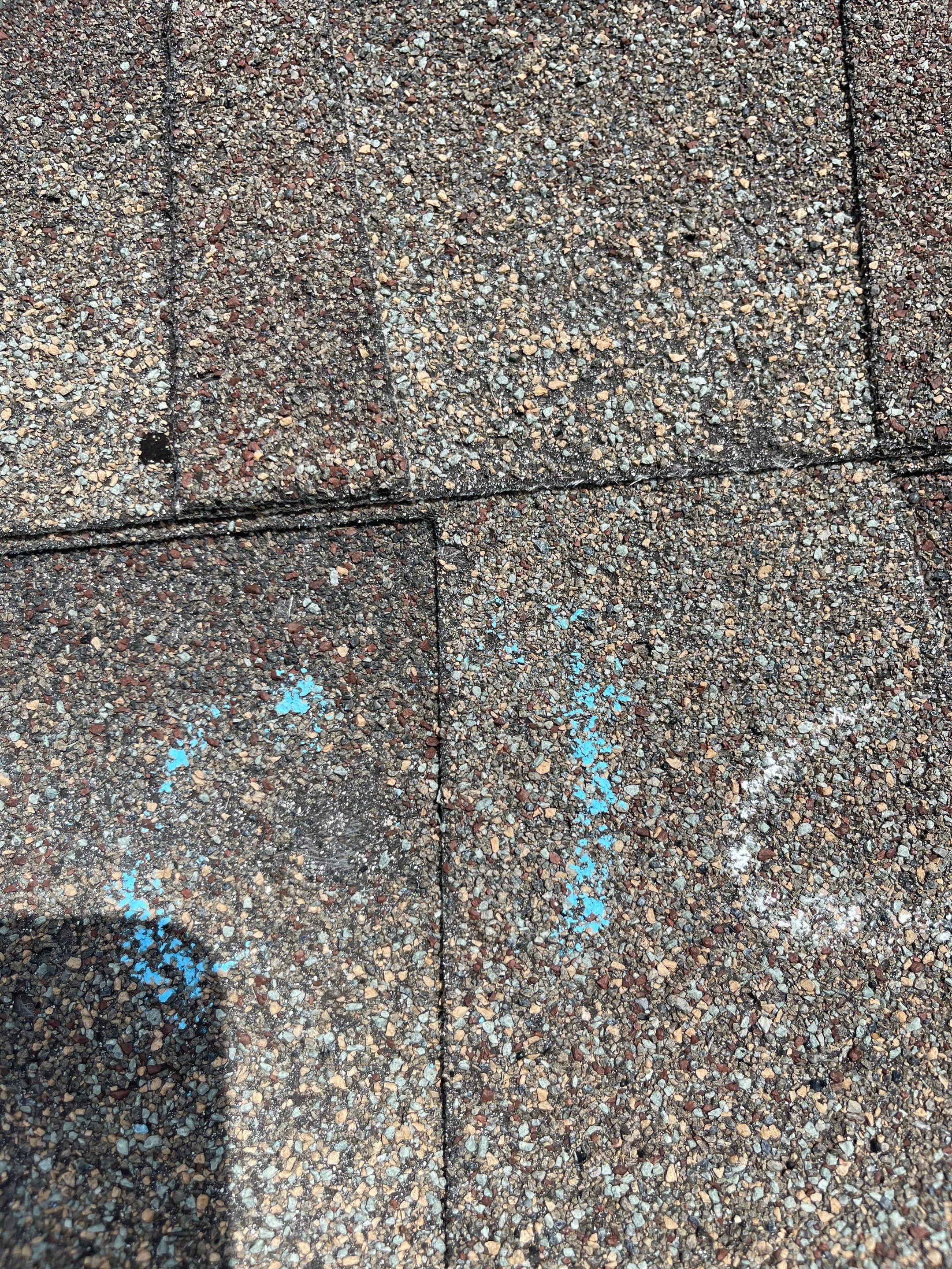 Hail Damage on a Roofing System by Icon Roofing And Construction 