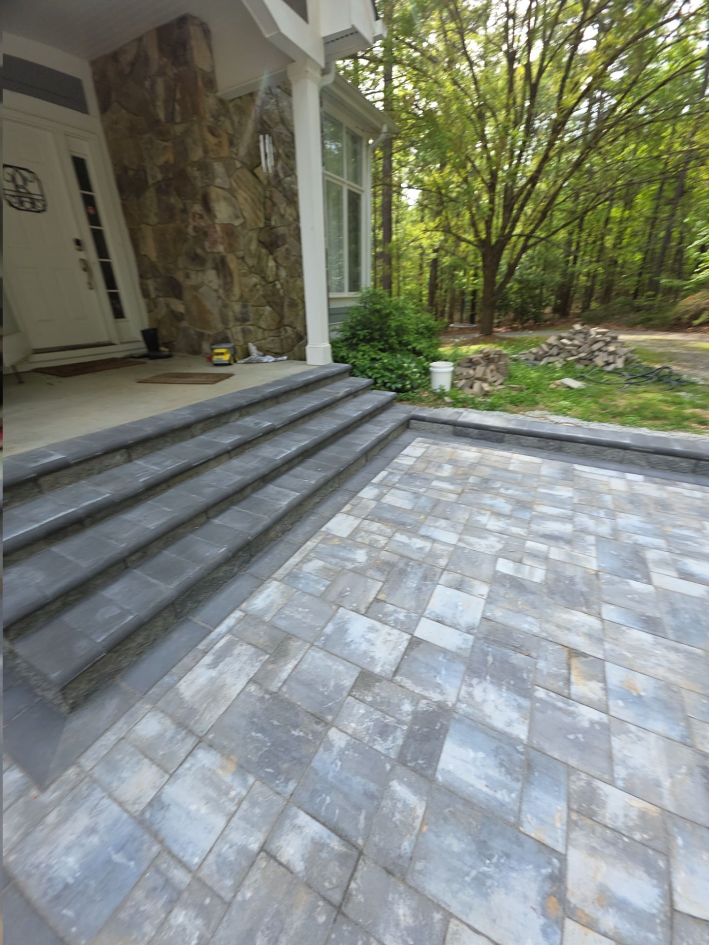 Pittsboro Outdoor Living Transformation – Retaining Wall, Paver Patio & Elevated Deck by Elite Remodeling and Design LLC