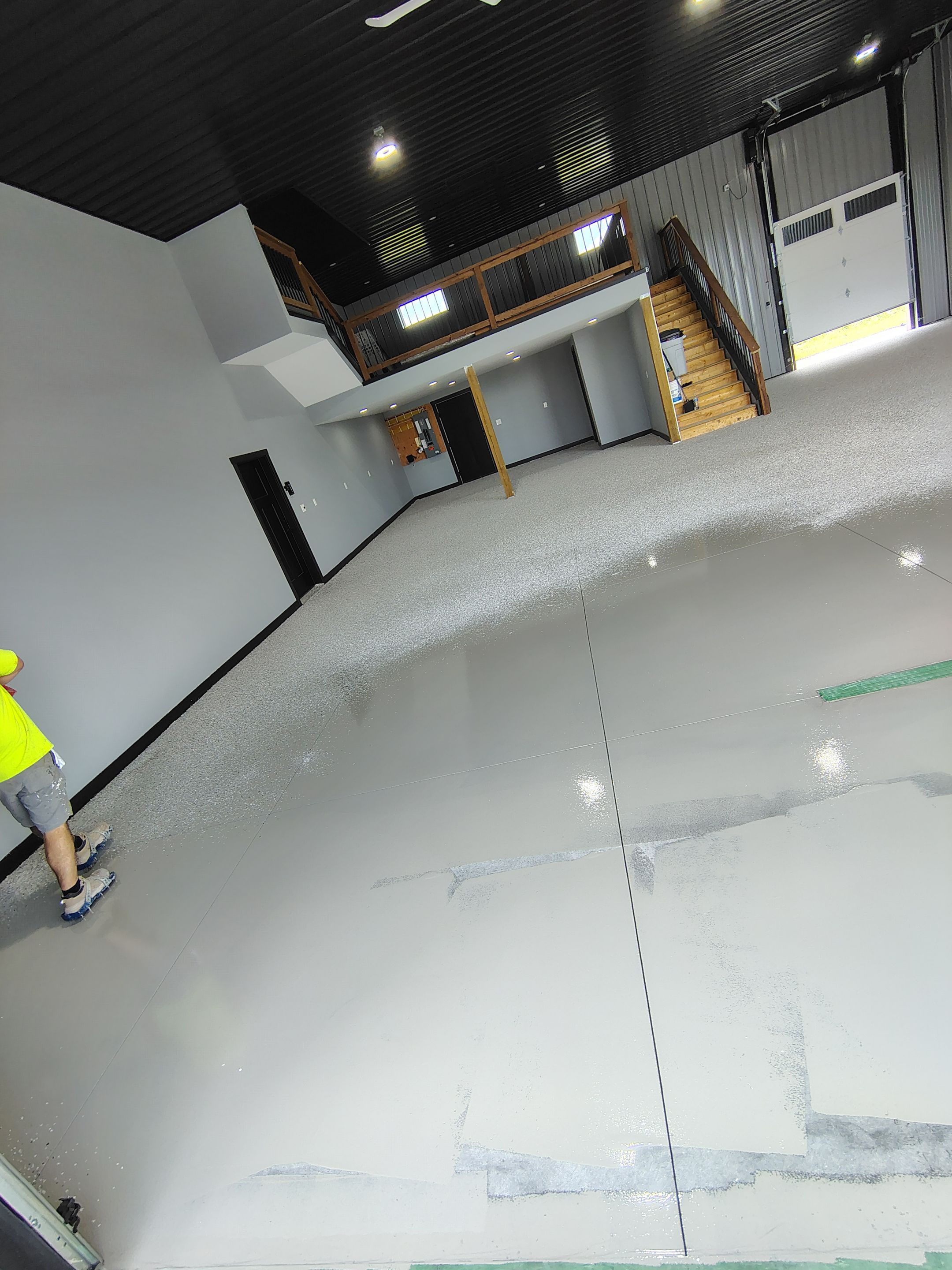 Polyaspartic Garage Floor Coating with Decorative Flake in Wentworth by Select Painting, Coatings & Garage Cabinets
