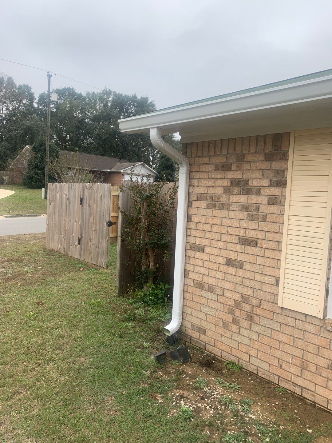 White Seamless Gutter Installation in Milton FL by Gutter Professors