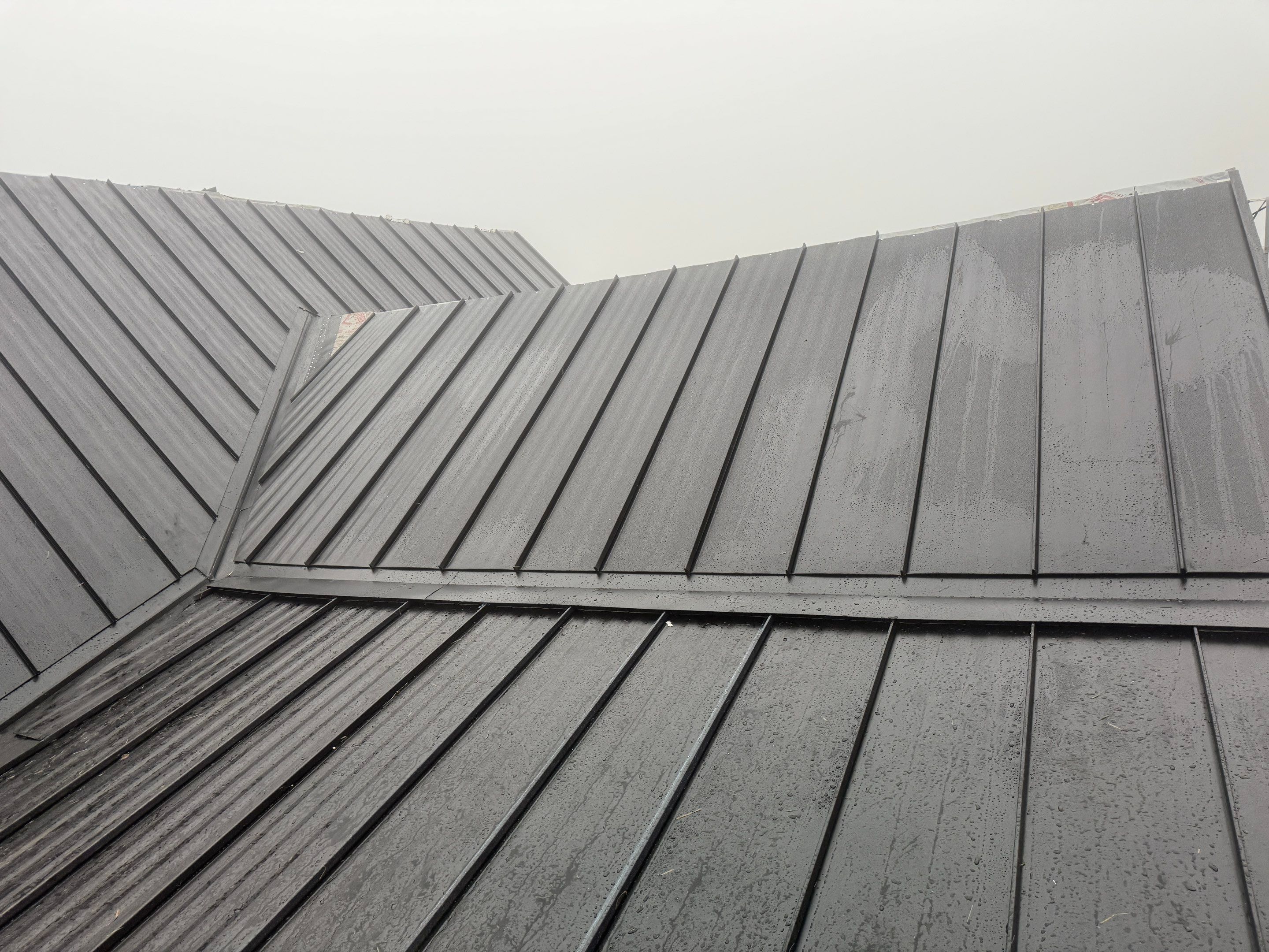 Black Standing Seam Metal Roof Installation in Wenatchee by Alpine Roofing