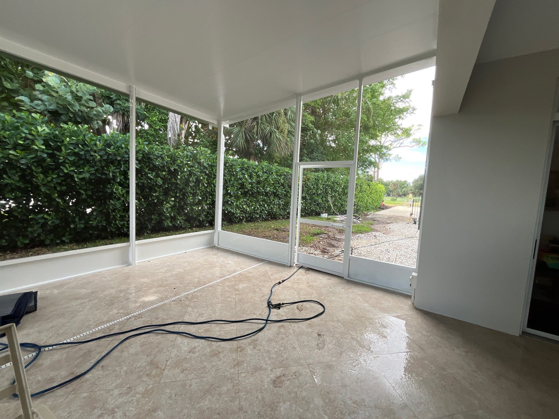 Aluminum Insulated Roof and Screen Enclosure Installation in Atlantis by The Screen Depot, Inc