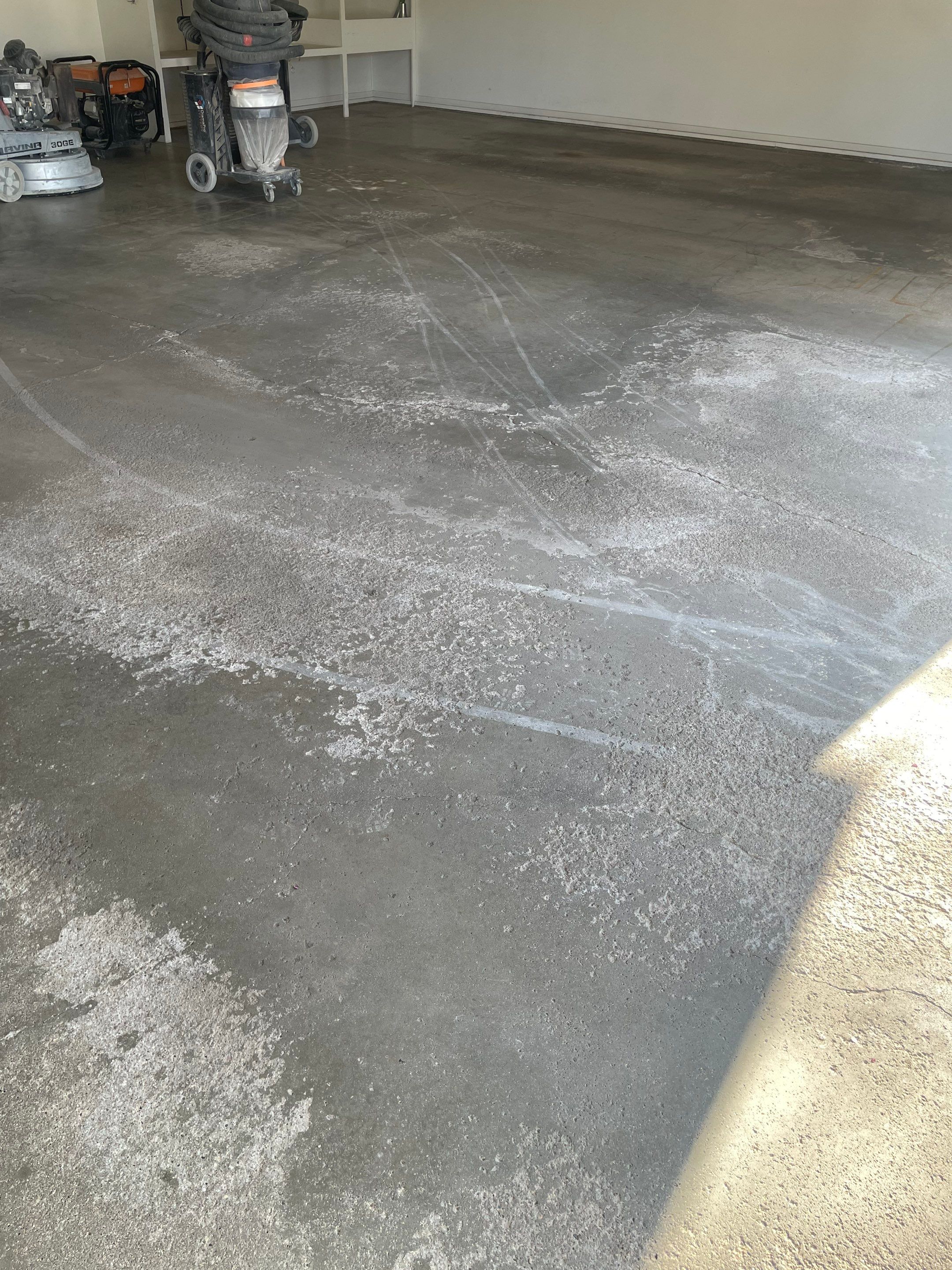 Yankton Garage Floor Restoration with Gray Speckled Epoxy Coating by Select Painting, Coatings & Garage Cabinets