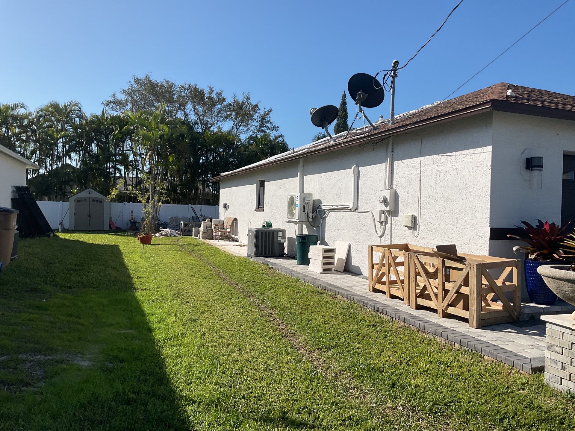 Brown Gutter + White and Brown Downspouts in Cape Coral FL by Gutter Professors
