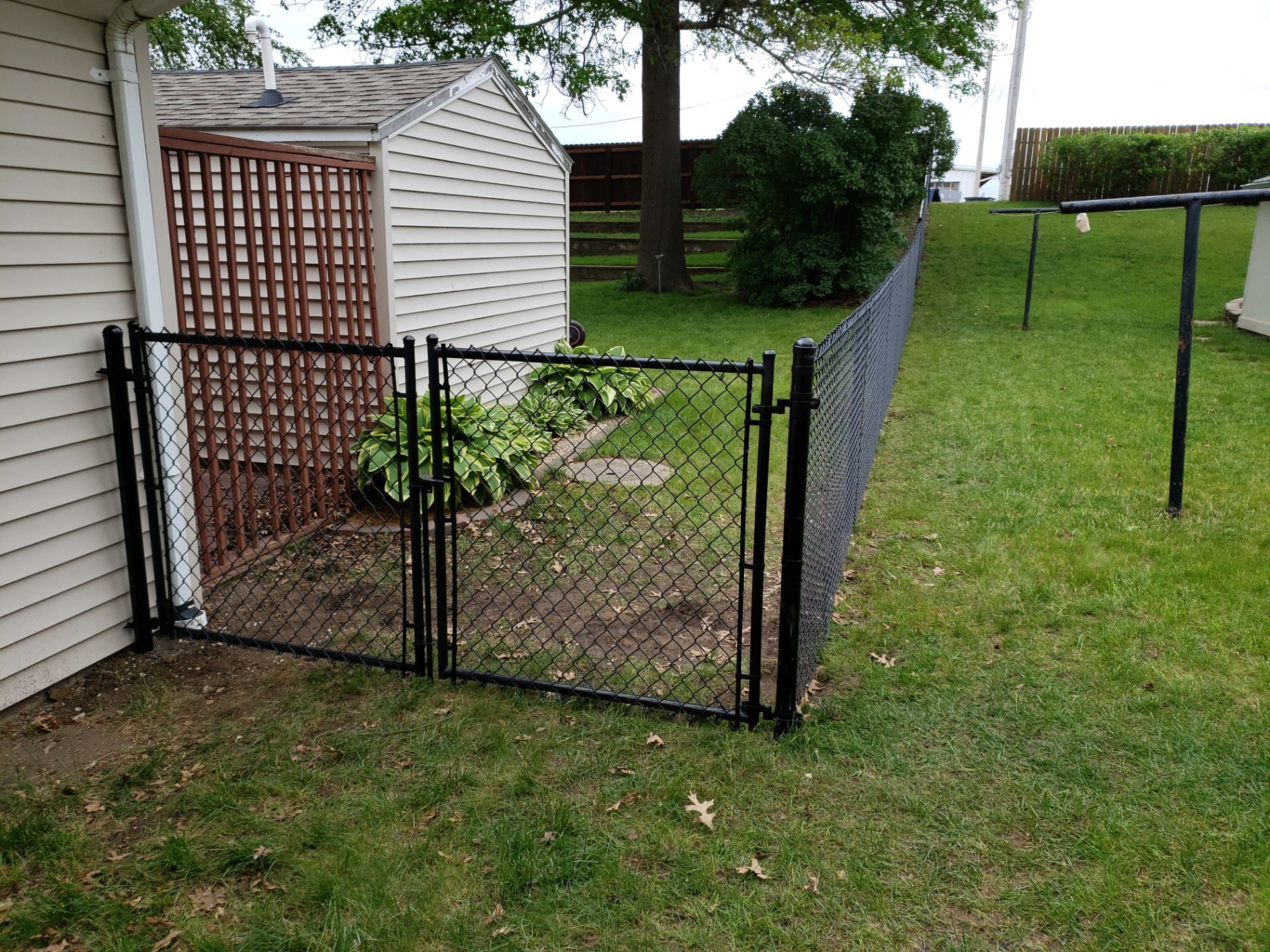 Chain Link and Cedar Privacy in Grundy Center by Perfect Picket Fence and Stain