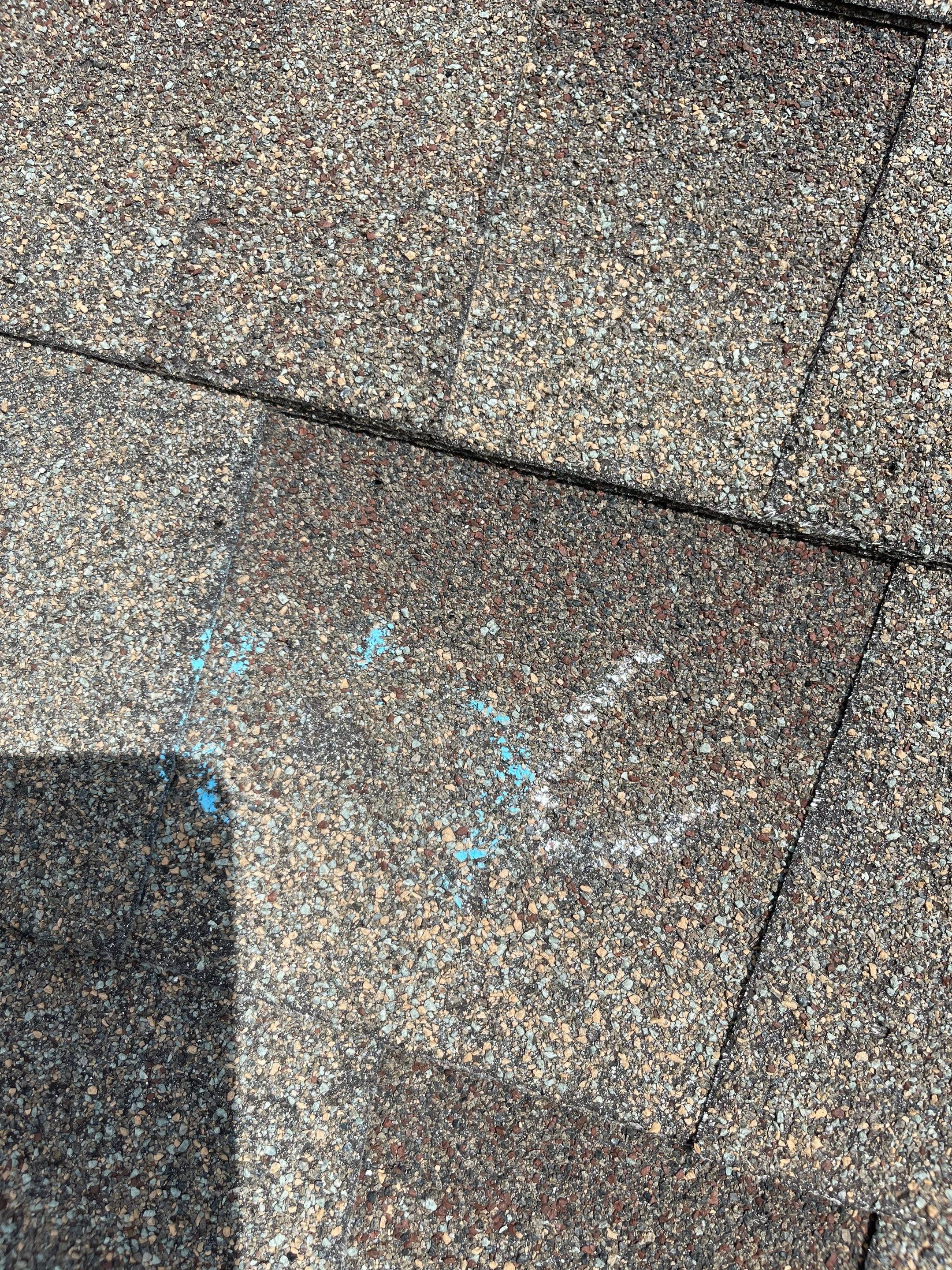 Hail Damage on a Roofing System by Icon Roofing And Construction 