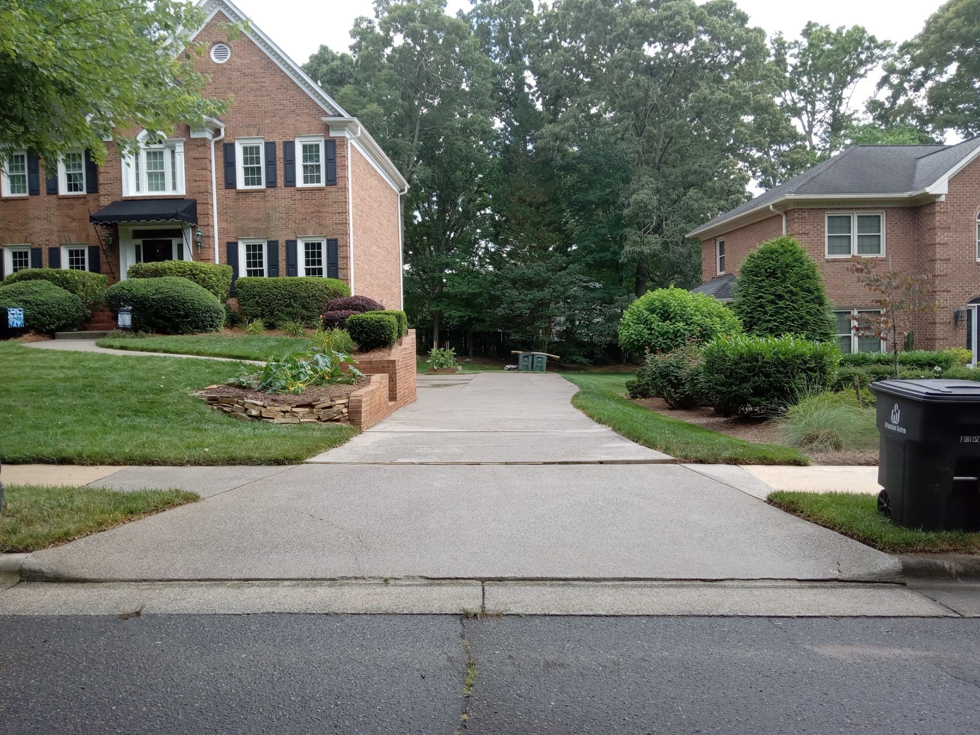 pressure washing driveway and walkway surfaces to remove dirt buildup and stains