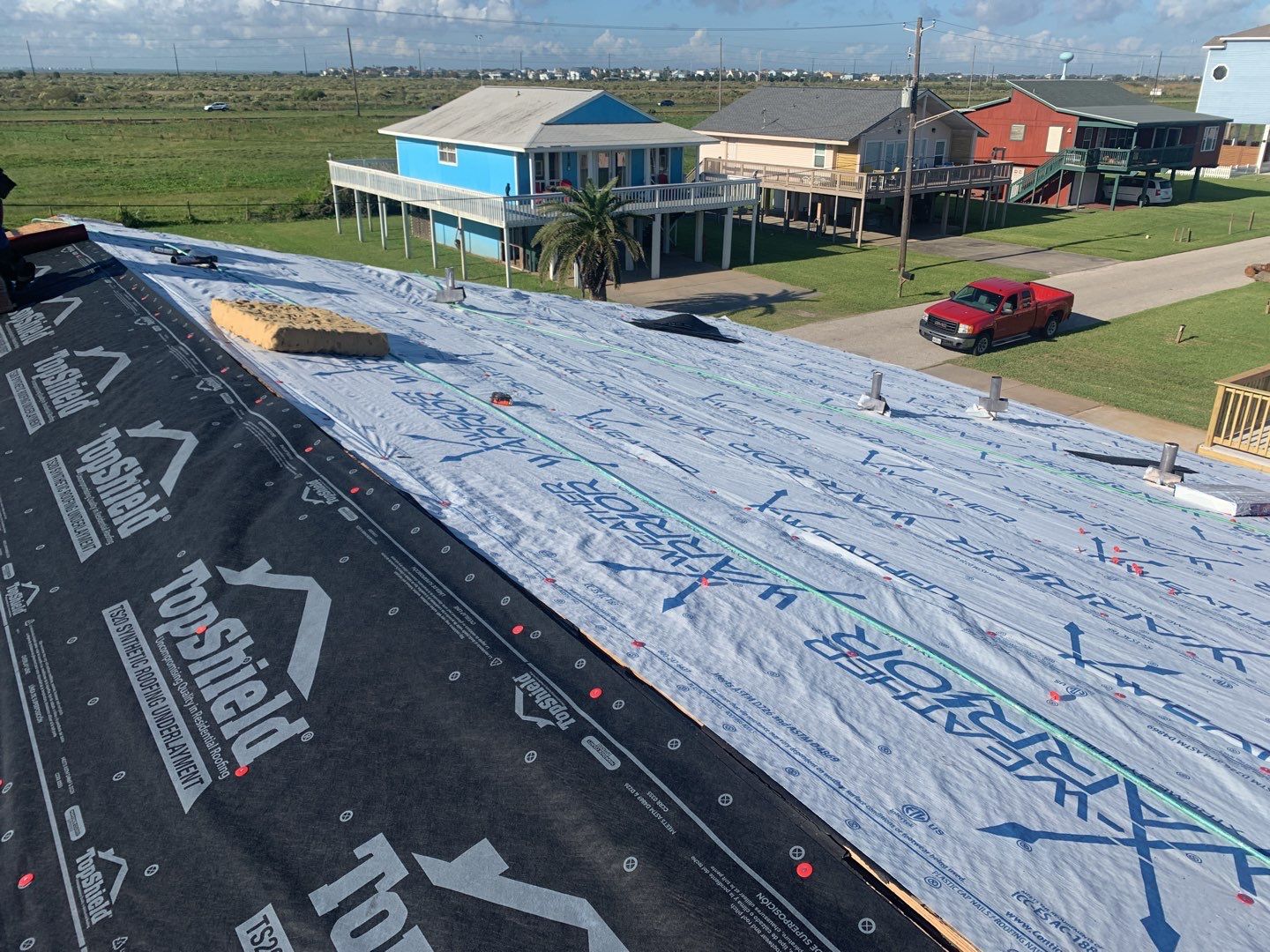 Galveston Waterfront Roof Installation In Progress by Elite Roofing LLC