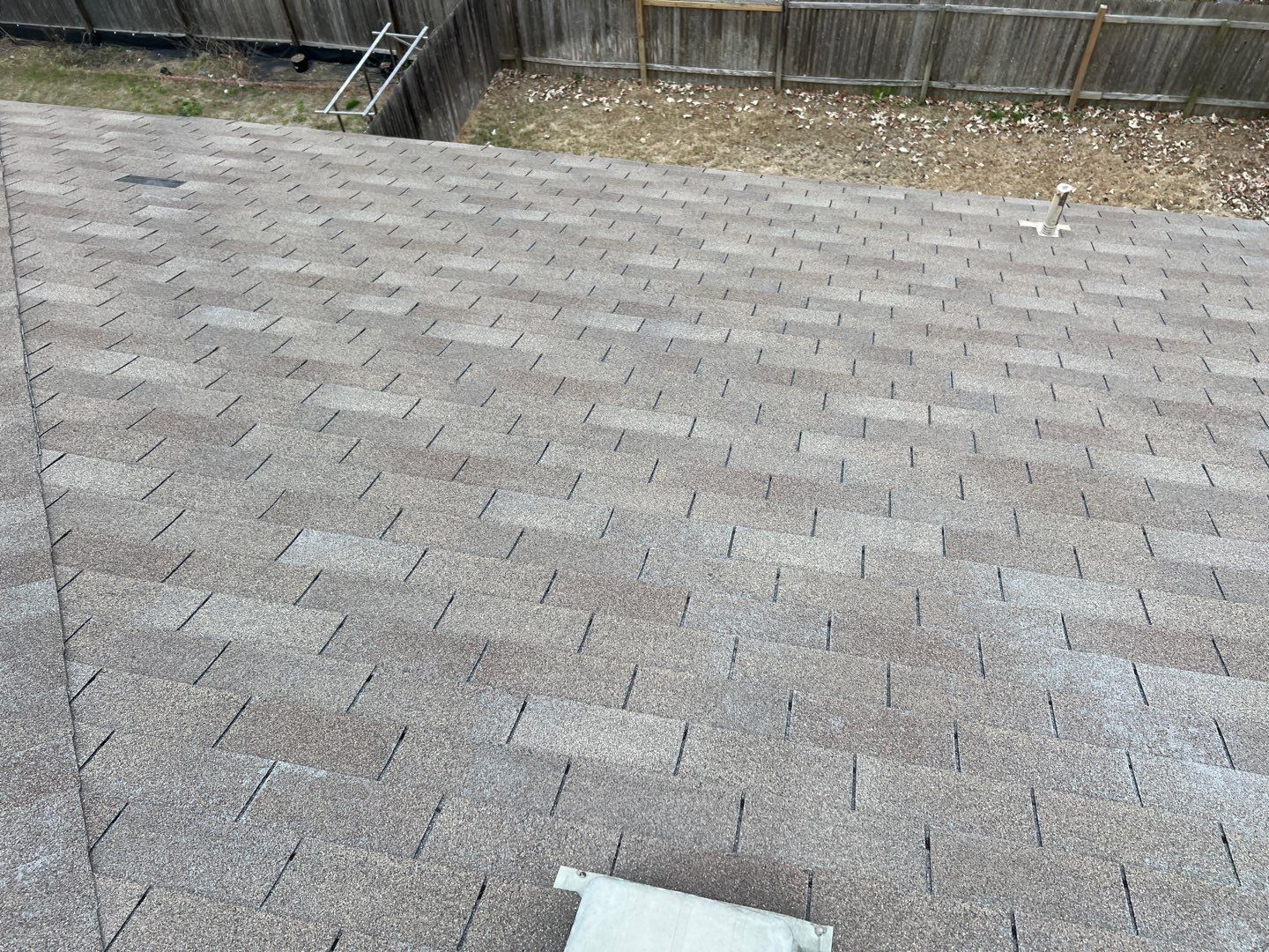 Wind damaged roof replacement by Oakwood Roofing and Construction, LLC