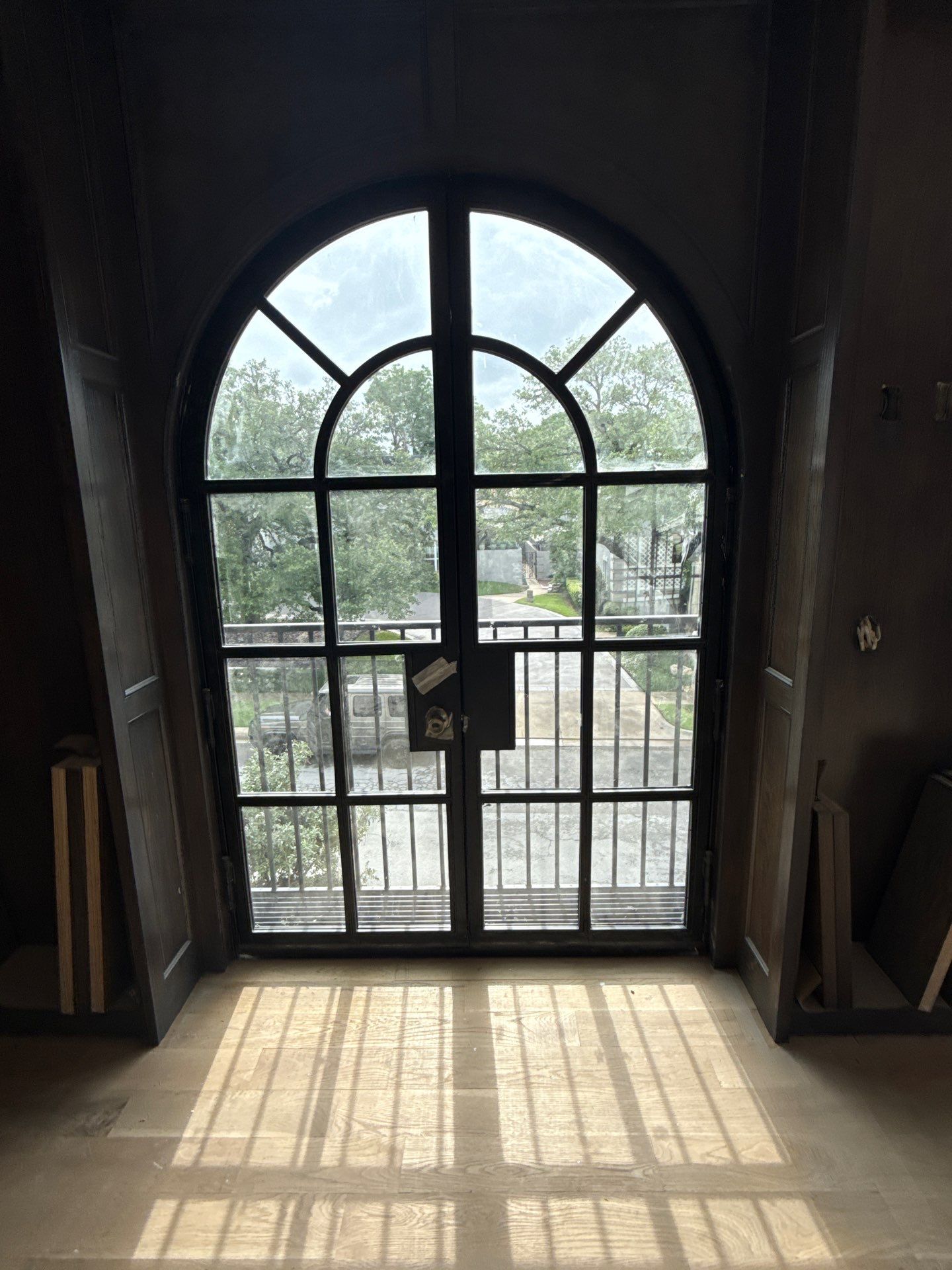 Arched Black Metal French Door Installation and Finishing in Fort Worth by Solara Custom Living