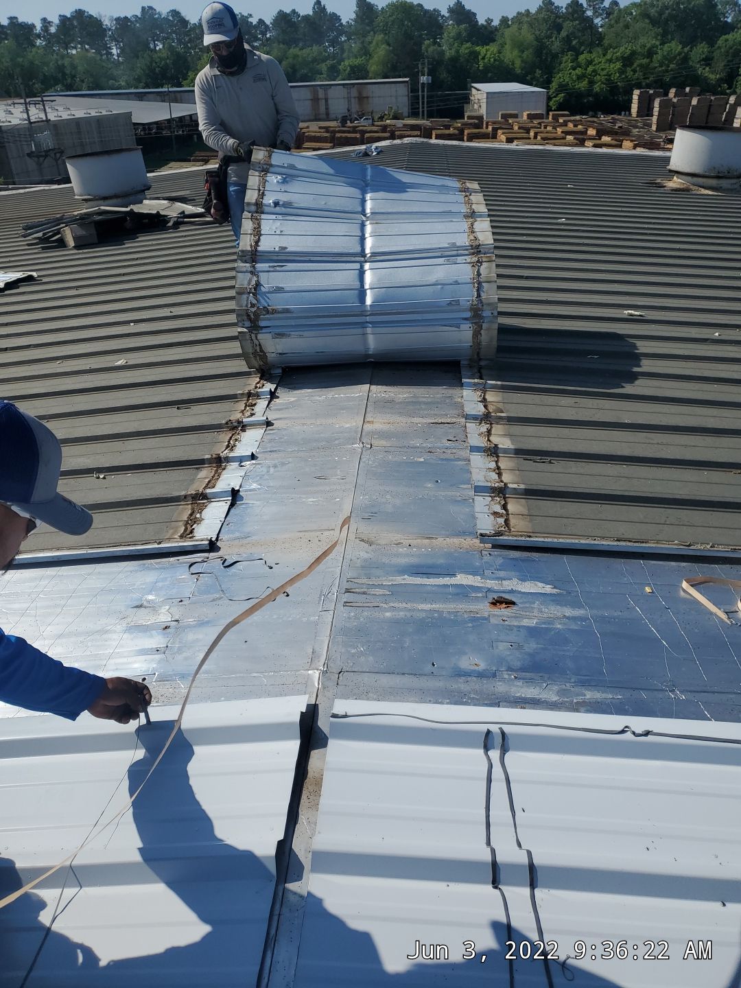 Commercial Roofing Installation using Aluminum Roofing panels by Hostetler Roofing