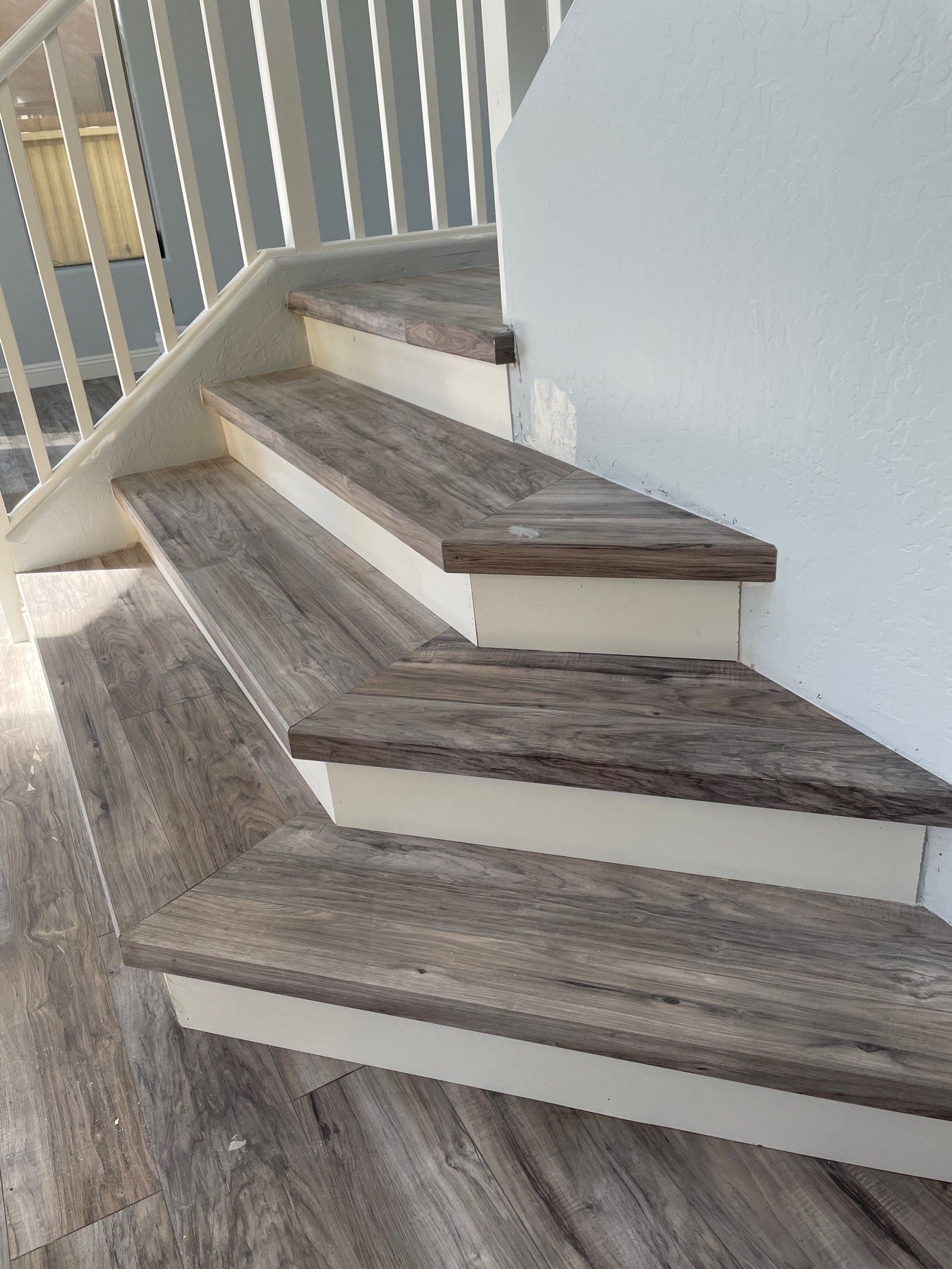 Laminate Staircase and Flooring  by Footprints Floors of Chandler 