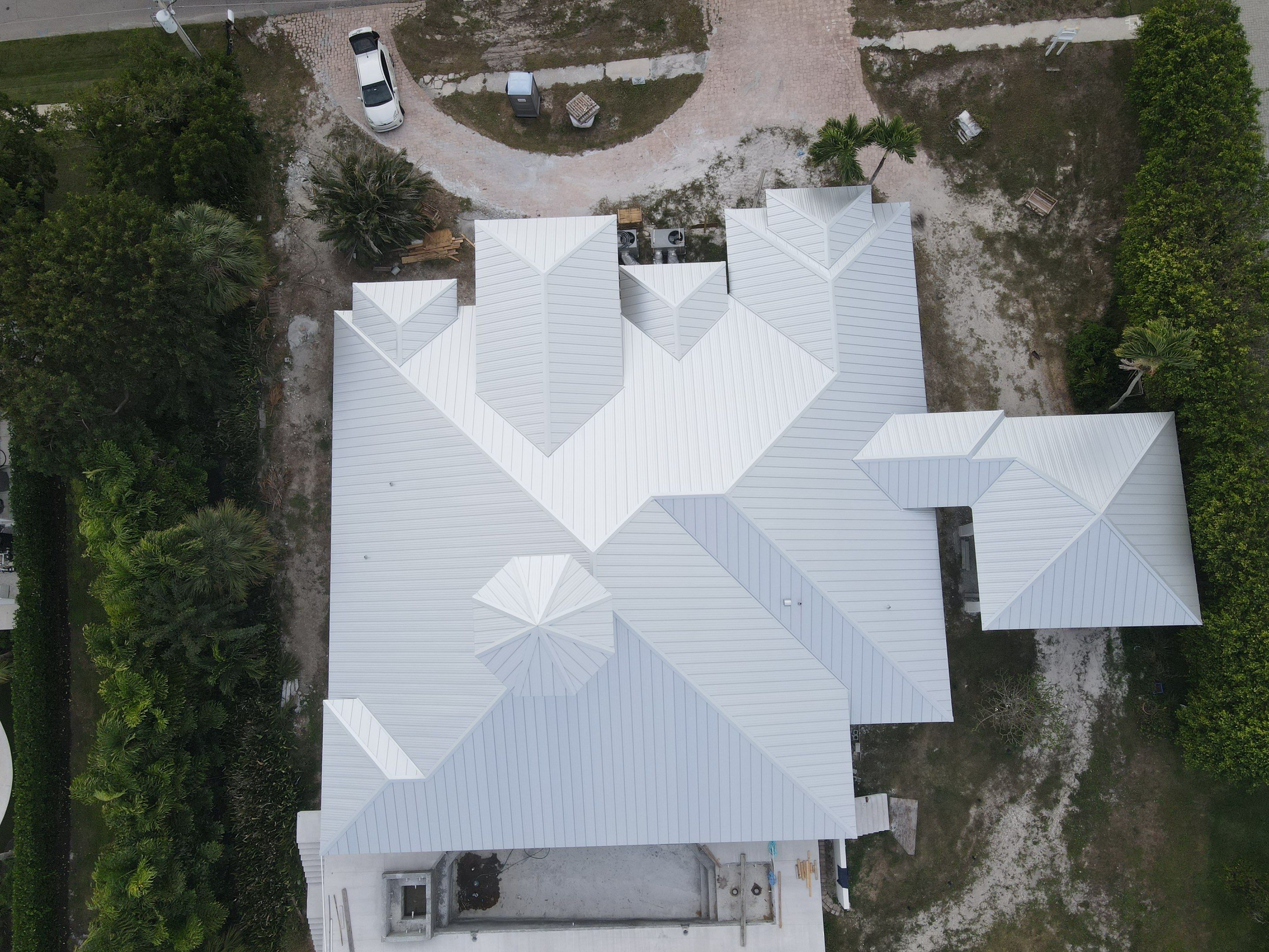 Residential Roofing Installation using Galvalume Standing Seam by Durabilis Roofing INC