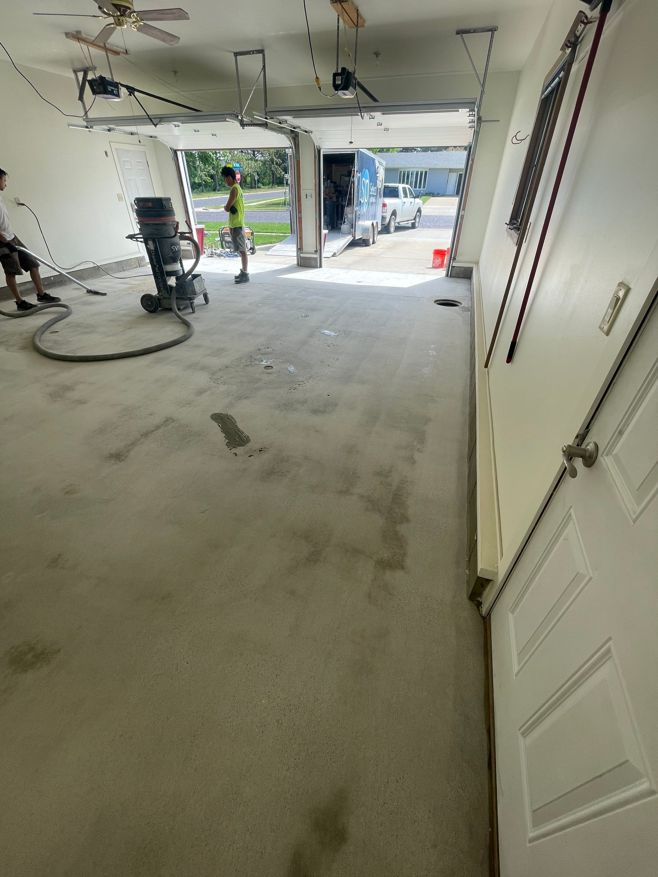 Madison Garage Concrete Coating with Feather Grey Speckle Finish by Select Painting, Coatings & Garage Cabinets