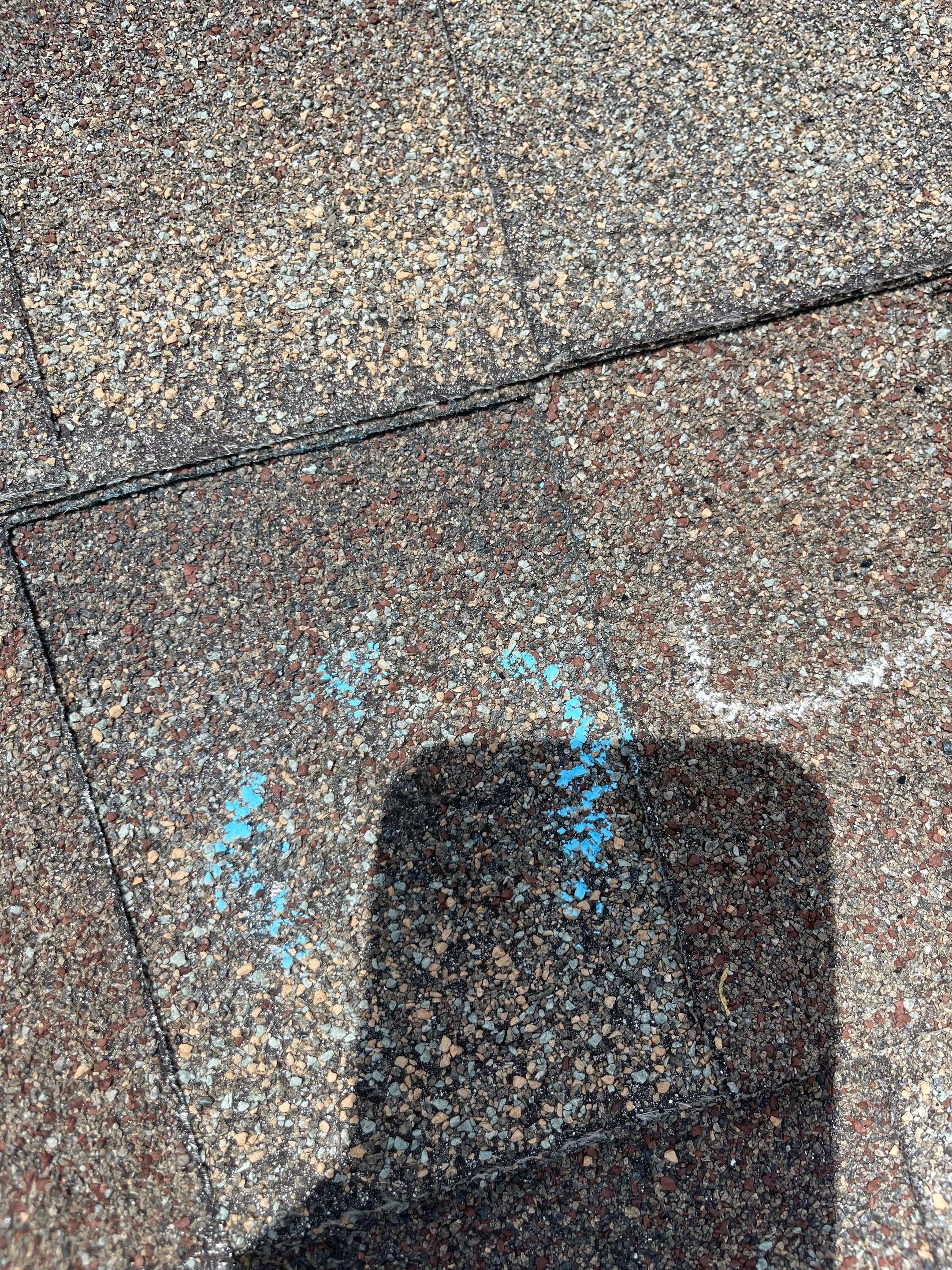 Hail Damage on a Roofing System by Icon Roofing And Construction 