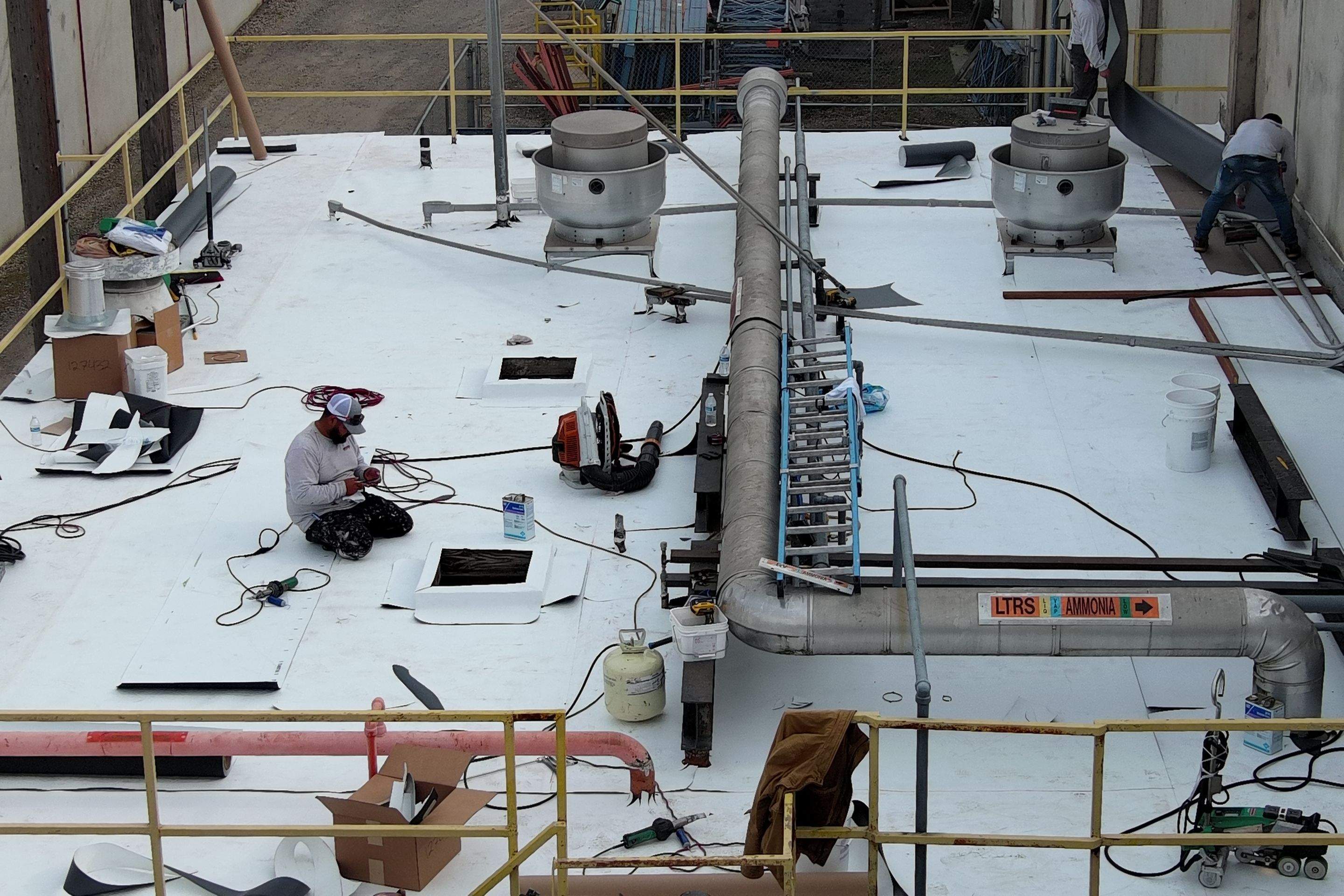 TPO single-ply roofing system using GAF Single-ply TPO 60 mil with 1.5 inch ISO board insulation by Straight Edge Roofing Inc