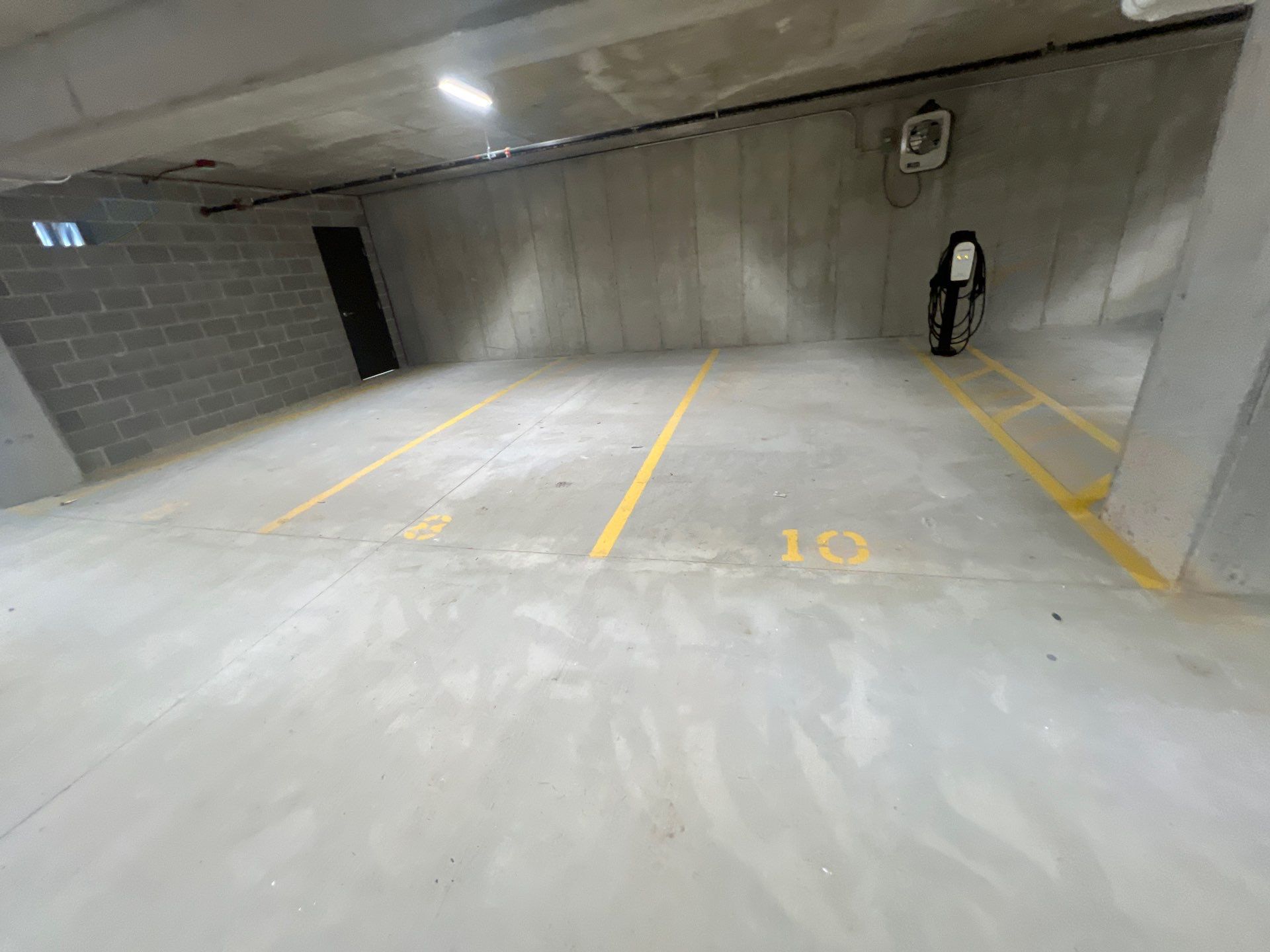 Parking garage using Hot water by Northern Power Washing LLC.