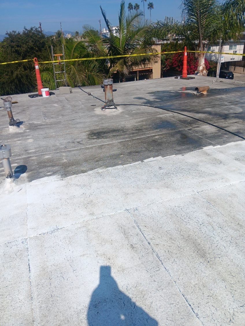 Commercial Roofing Installation using Silicone Coating by Hull Brothers Roofing