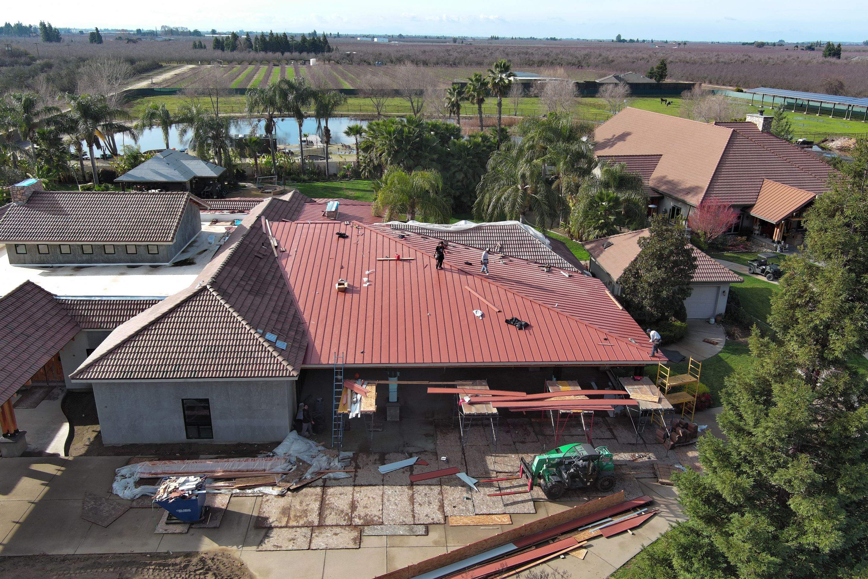 Tile, Metal, and TPO roofing project (new construction) by Straight Edge Roofing Inc